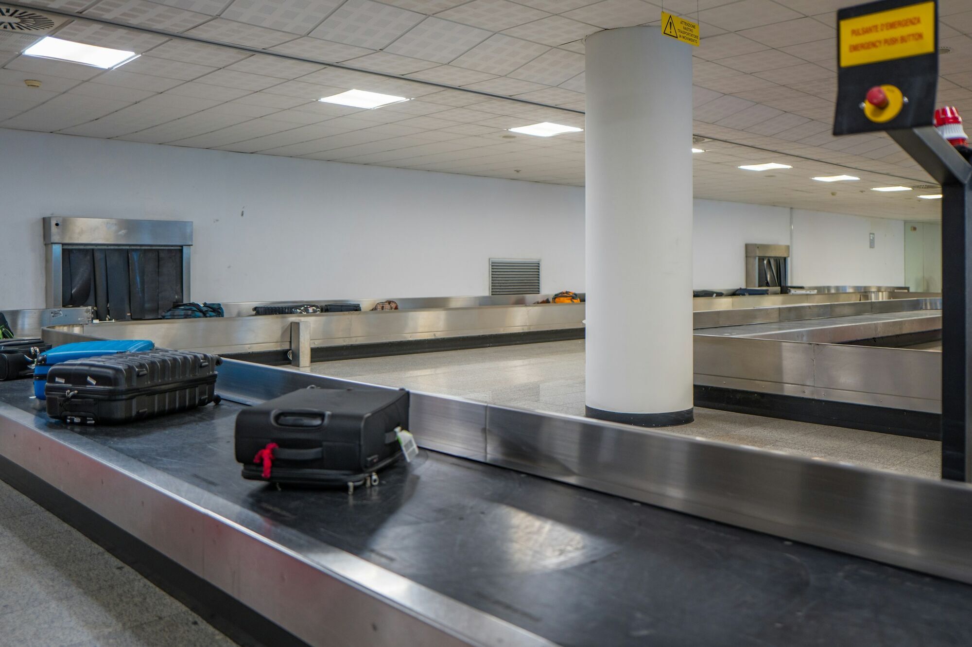 Checked luggage moving on an airport baggage carousel