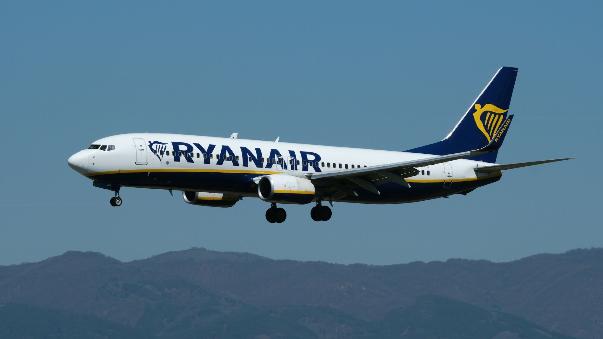 Ryanair Boeing 737 approaching for landing against a clear sky