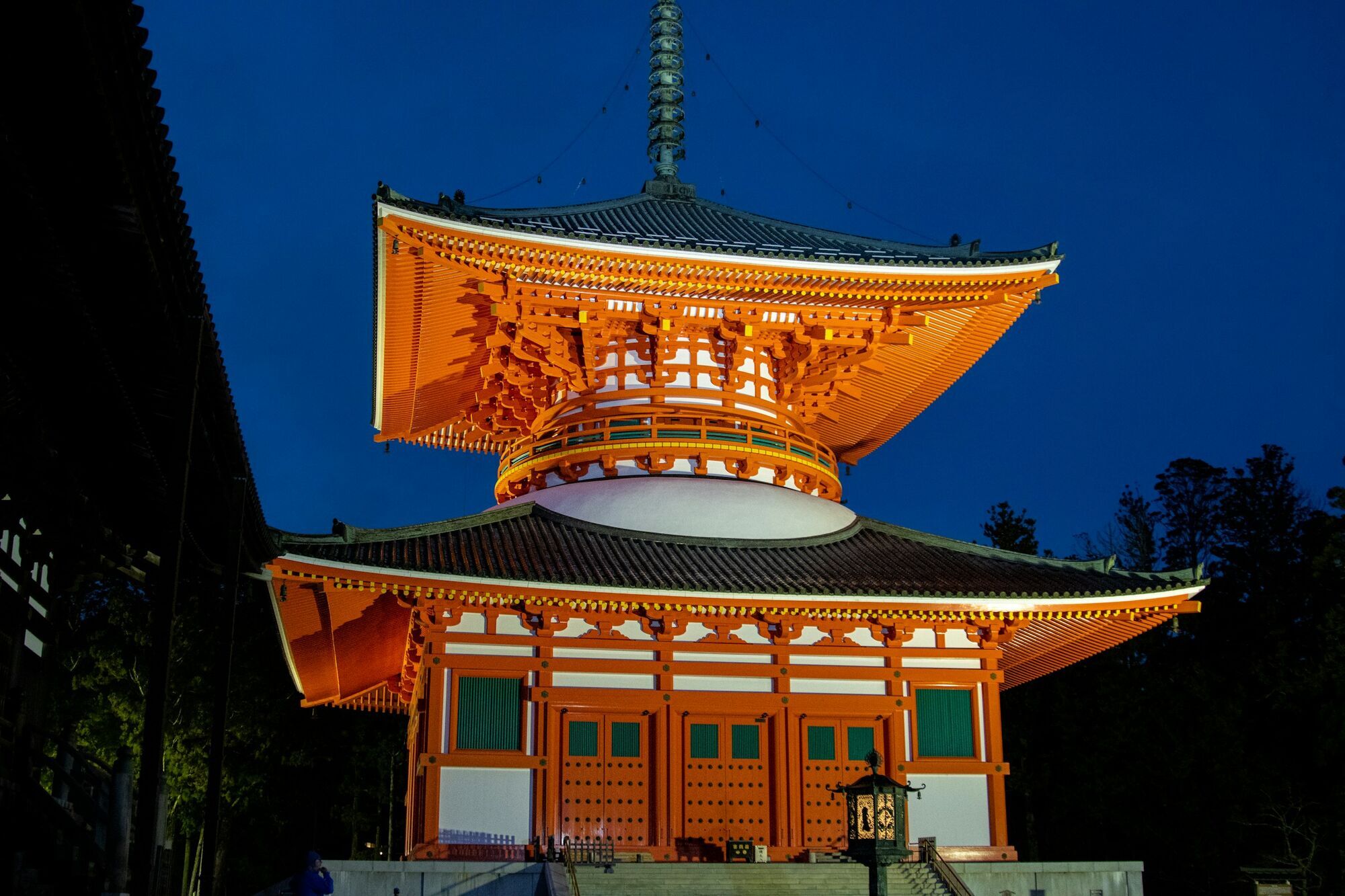 Illuminated temple building at Mount Kōya in the evening