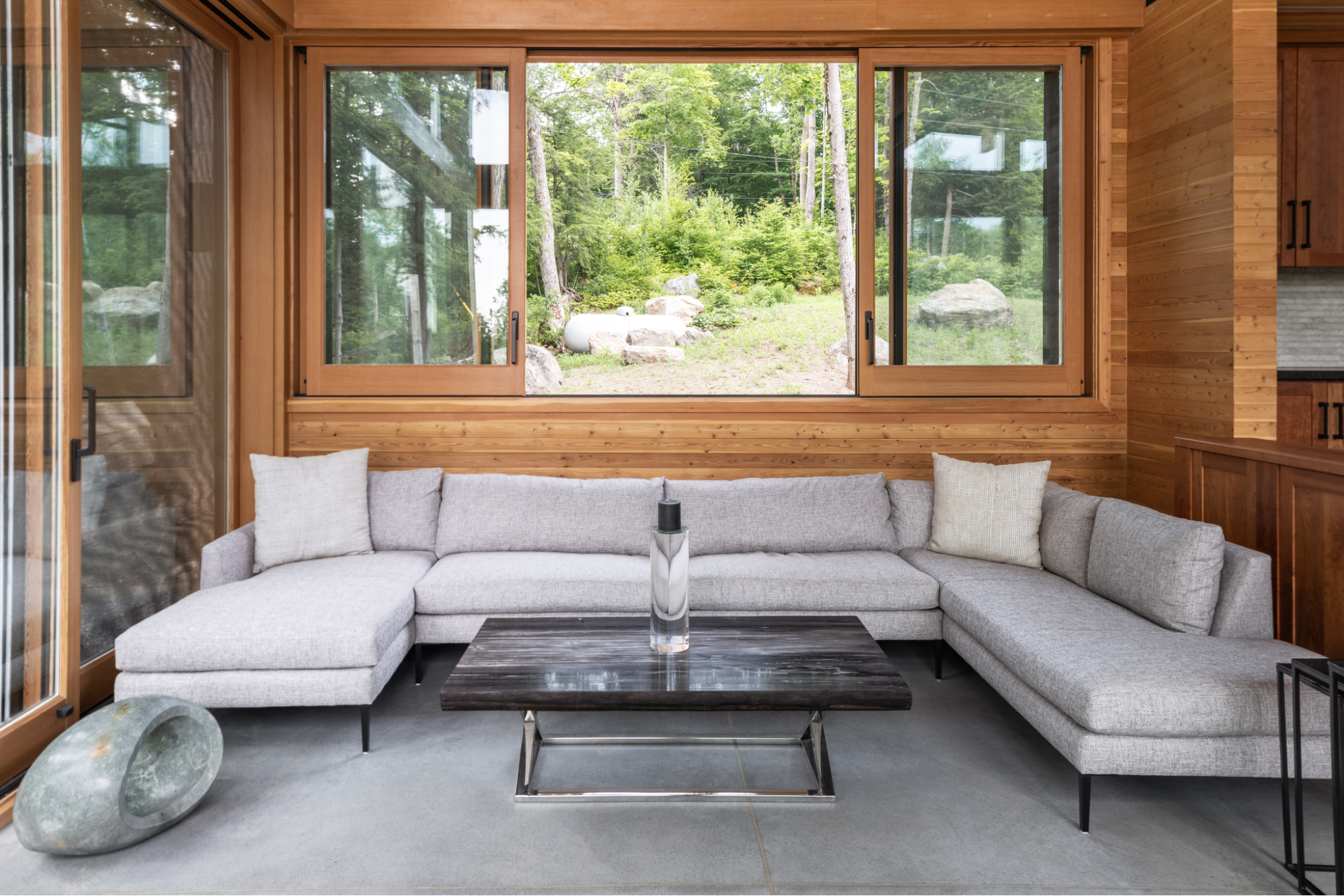 Barlochan Cottage living room with large forest-facing windows