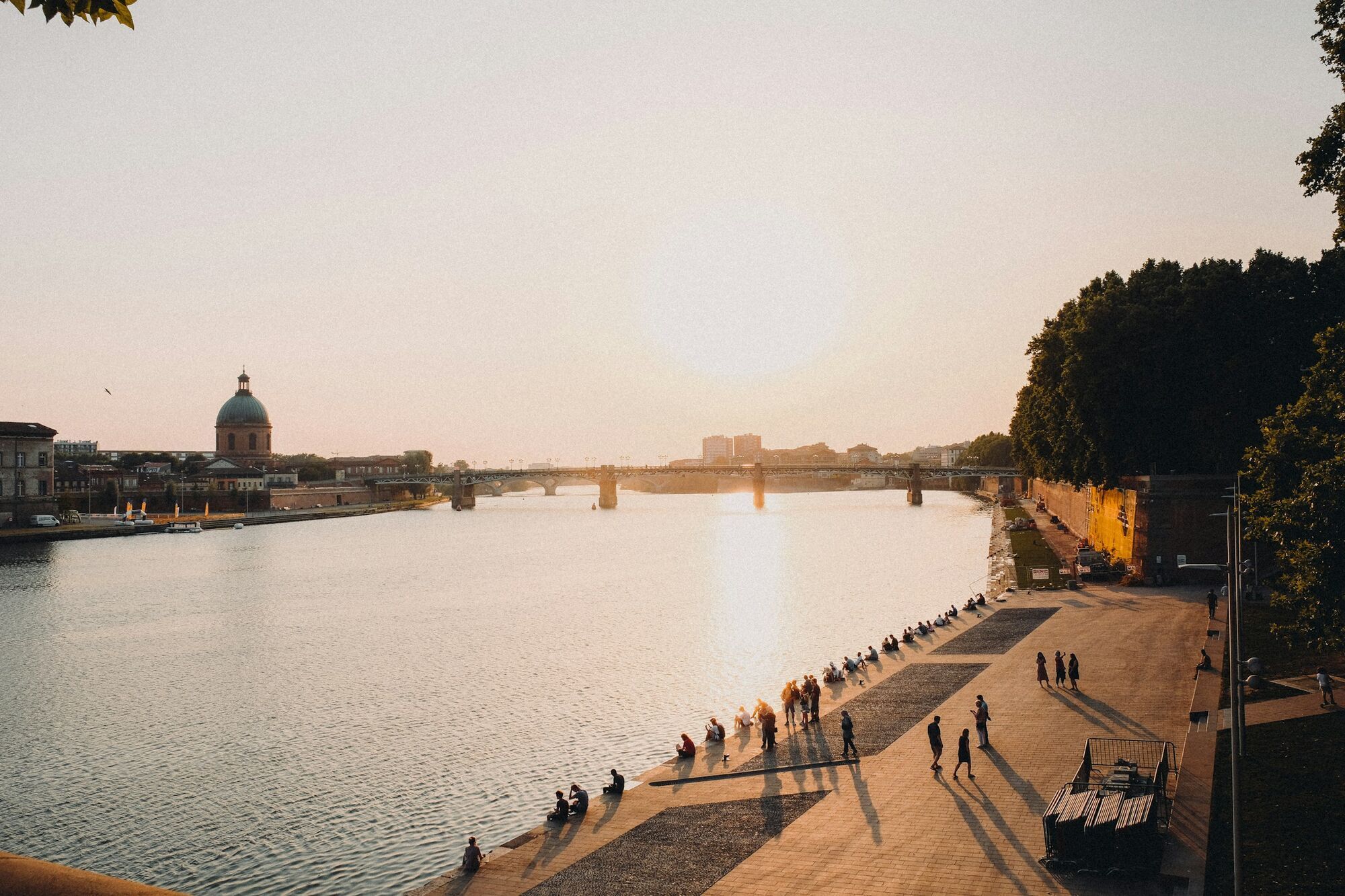 Riverside promenade along the Garonne River in Toulouse at sunset
