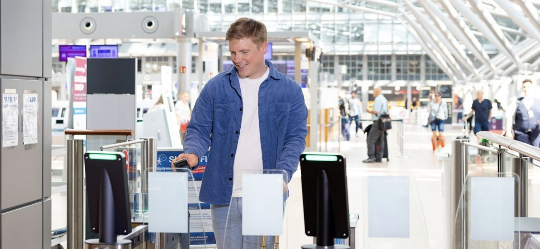 Passenger passing through automated airport security gate