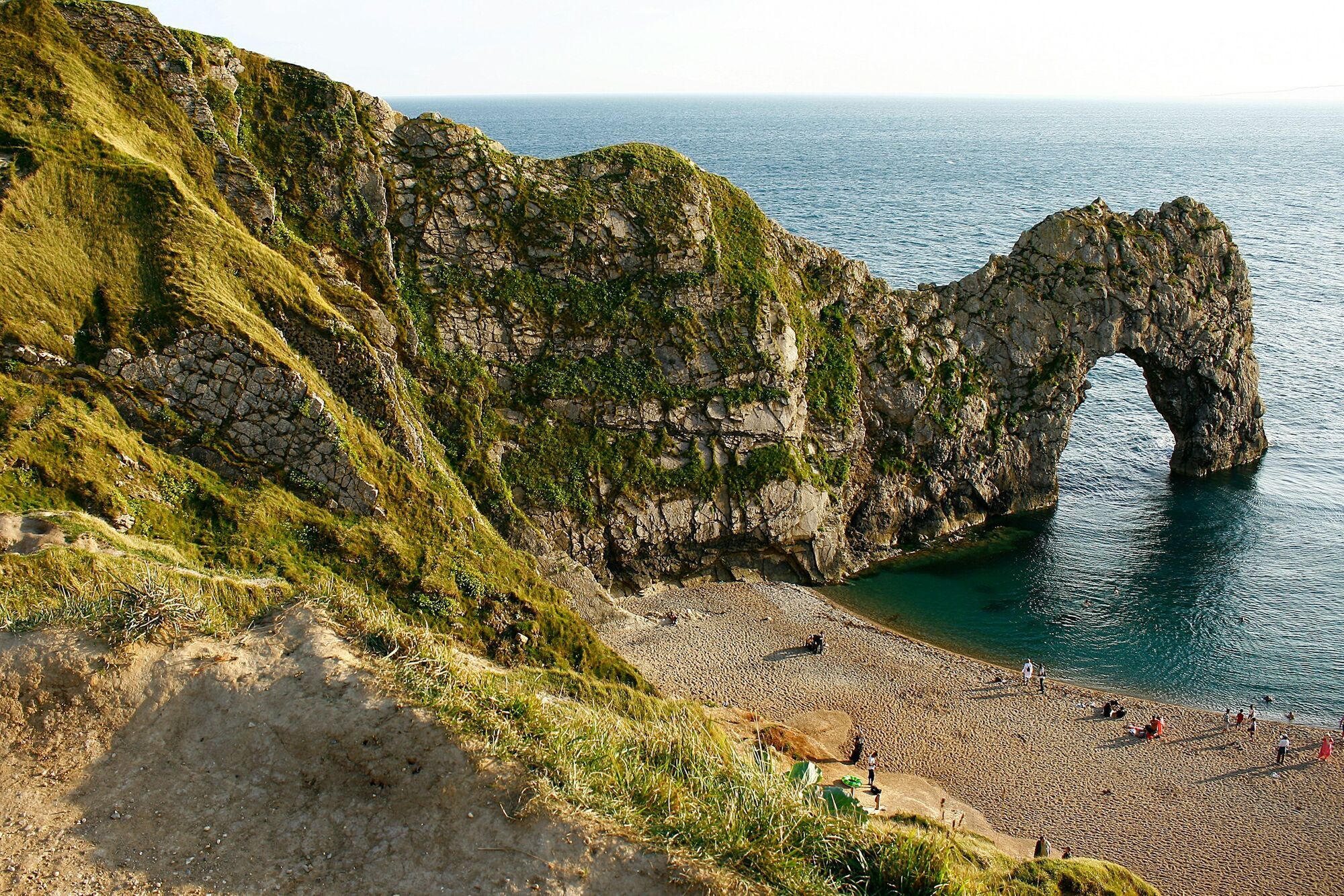 View of Durdle Door rock arch and coastline cliffs in Dorset
