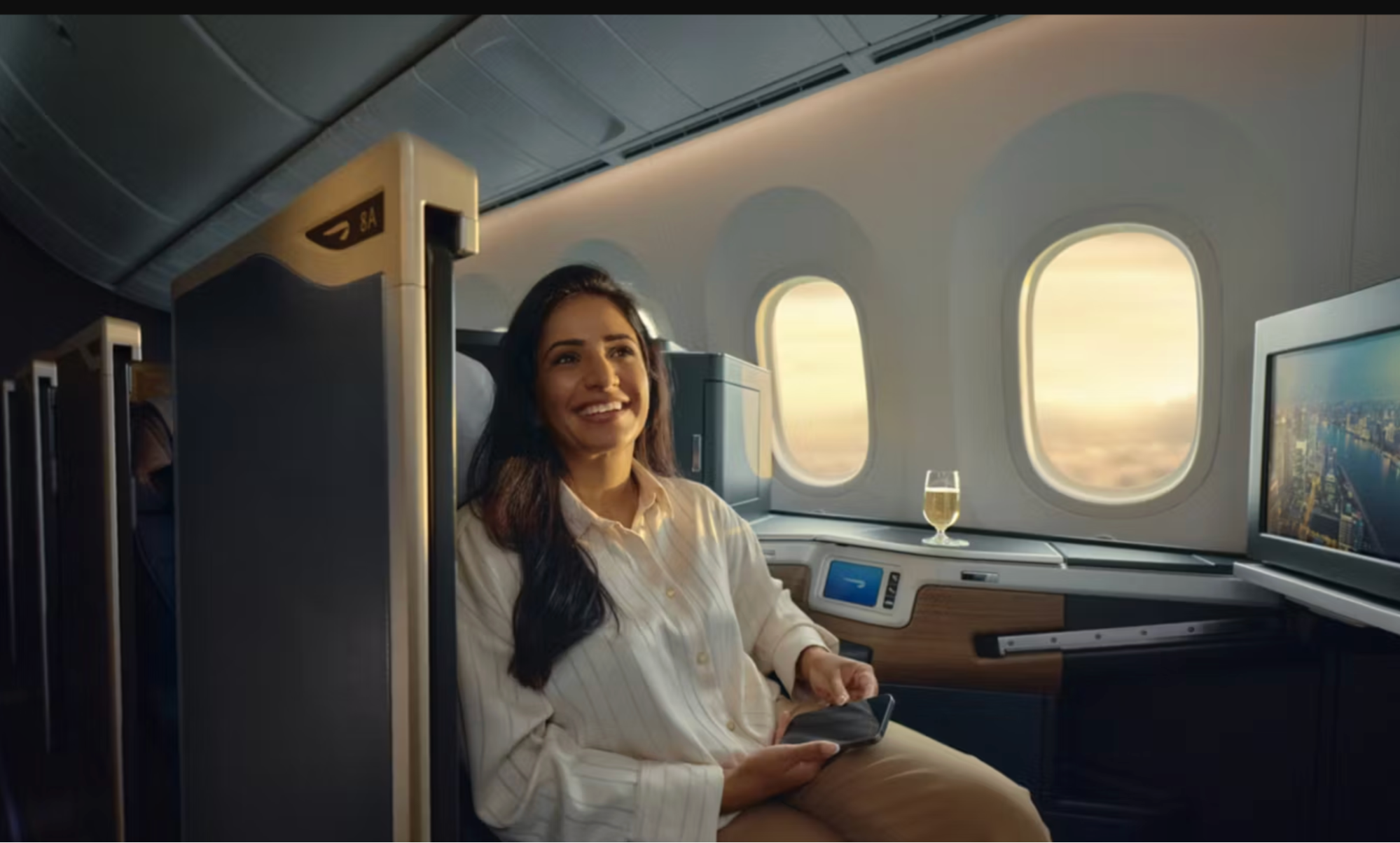 Passenger seated in business class cabin during flight