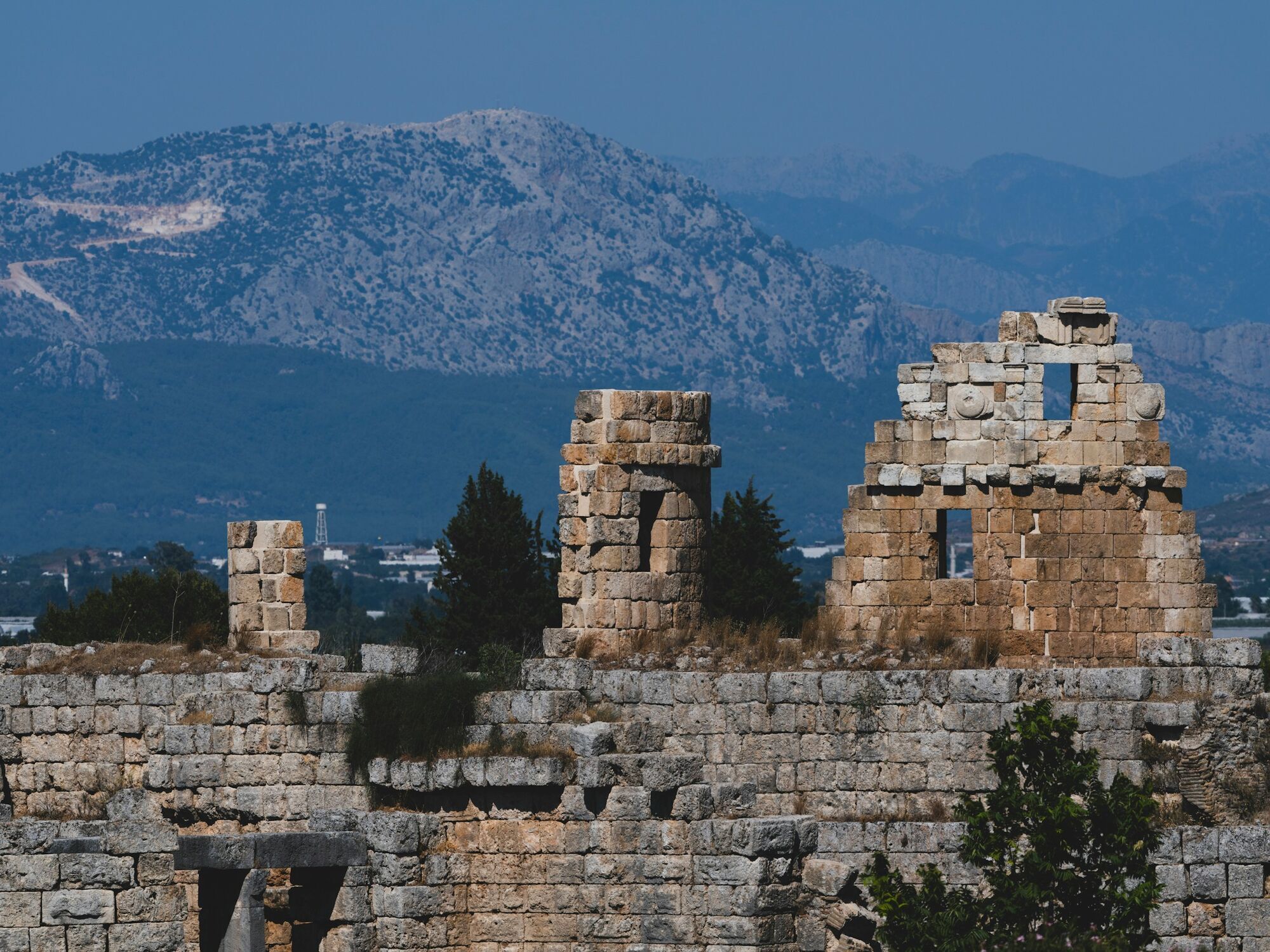 Ancient ruins near Antalya with mountain backdrop
