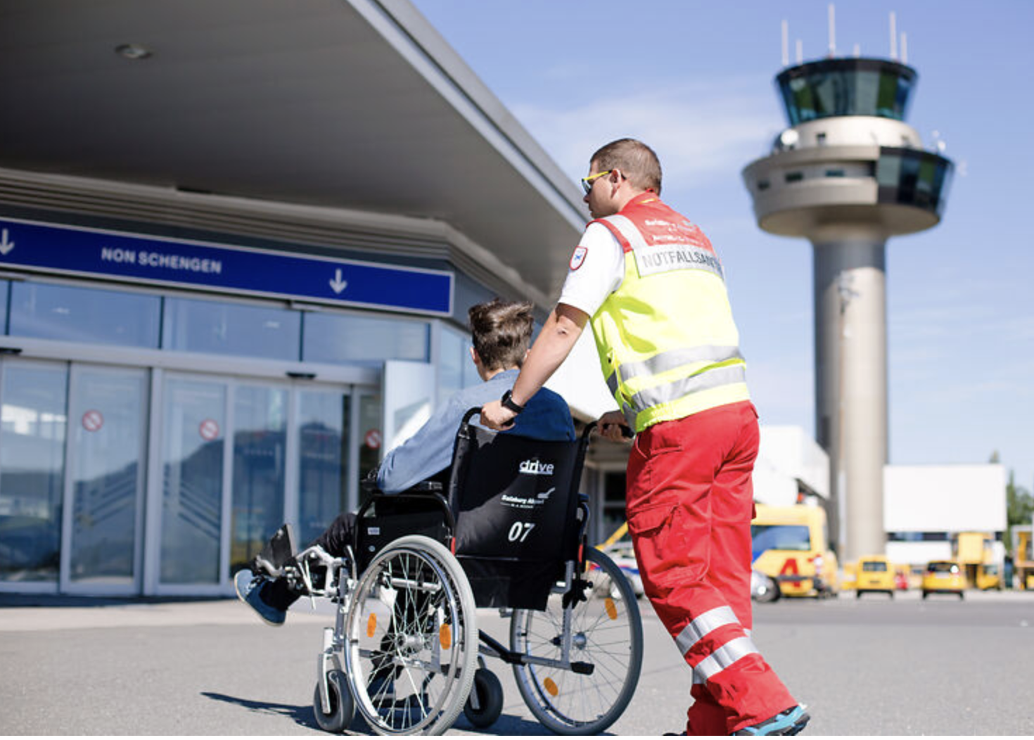 PRM passenger assisted by airport medical staff