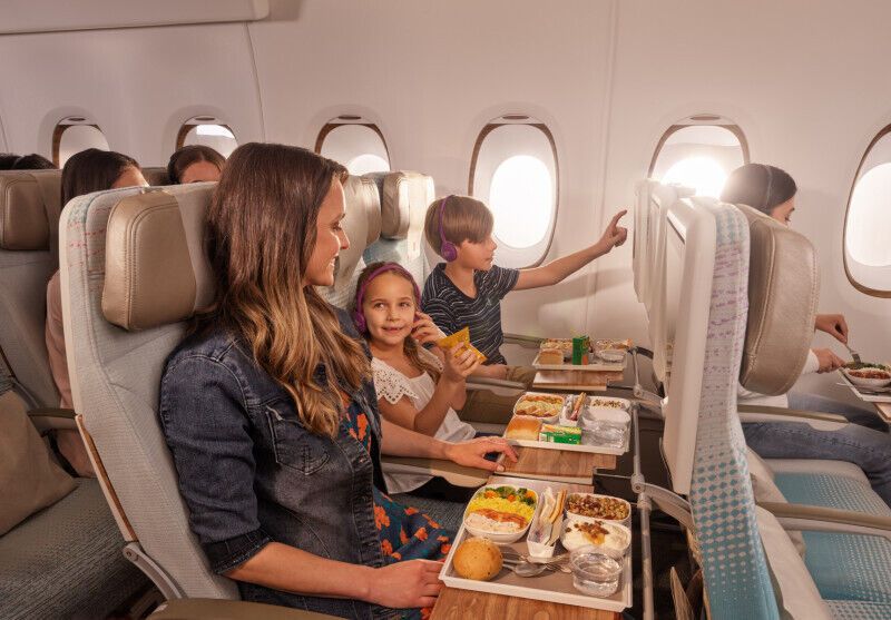 Family seated in Economy Class during an airline flight