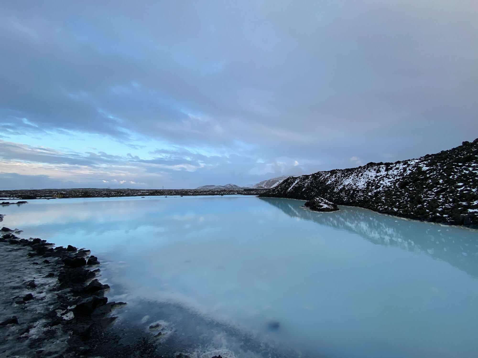 Blue Lagoon geothermal water surrounded by volcanic rock