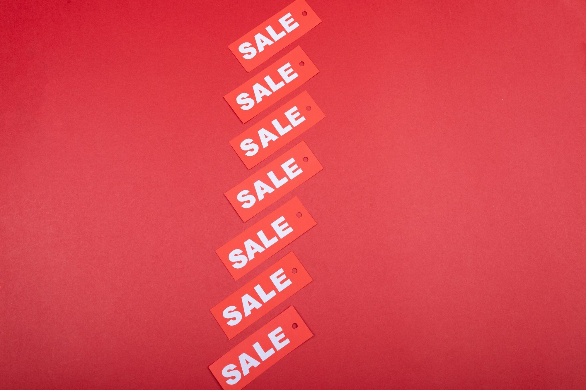 Sale tags displayed on red background
