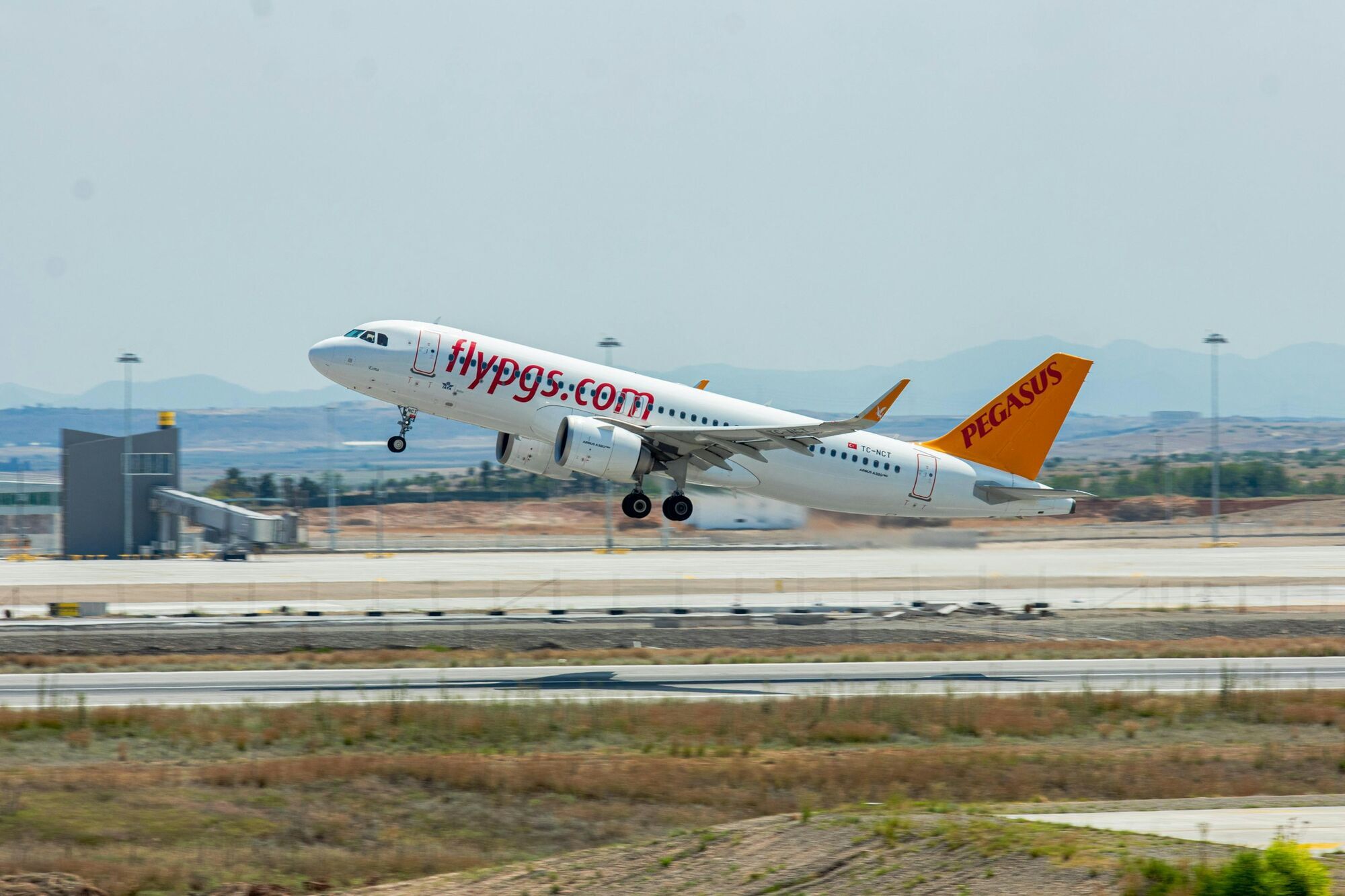 Pegasus Airlines aircraft taking off from runway
