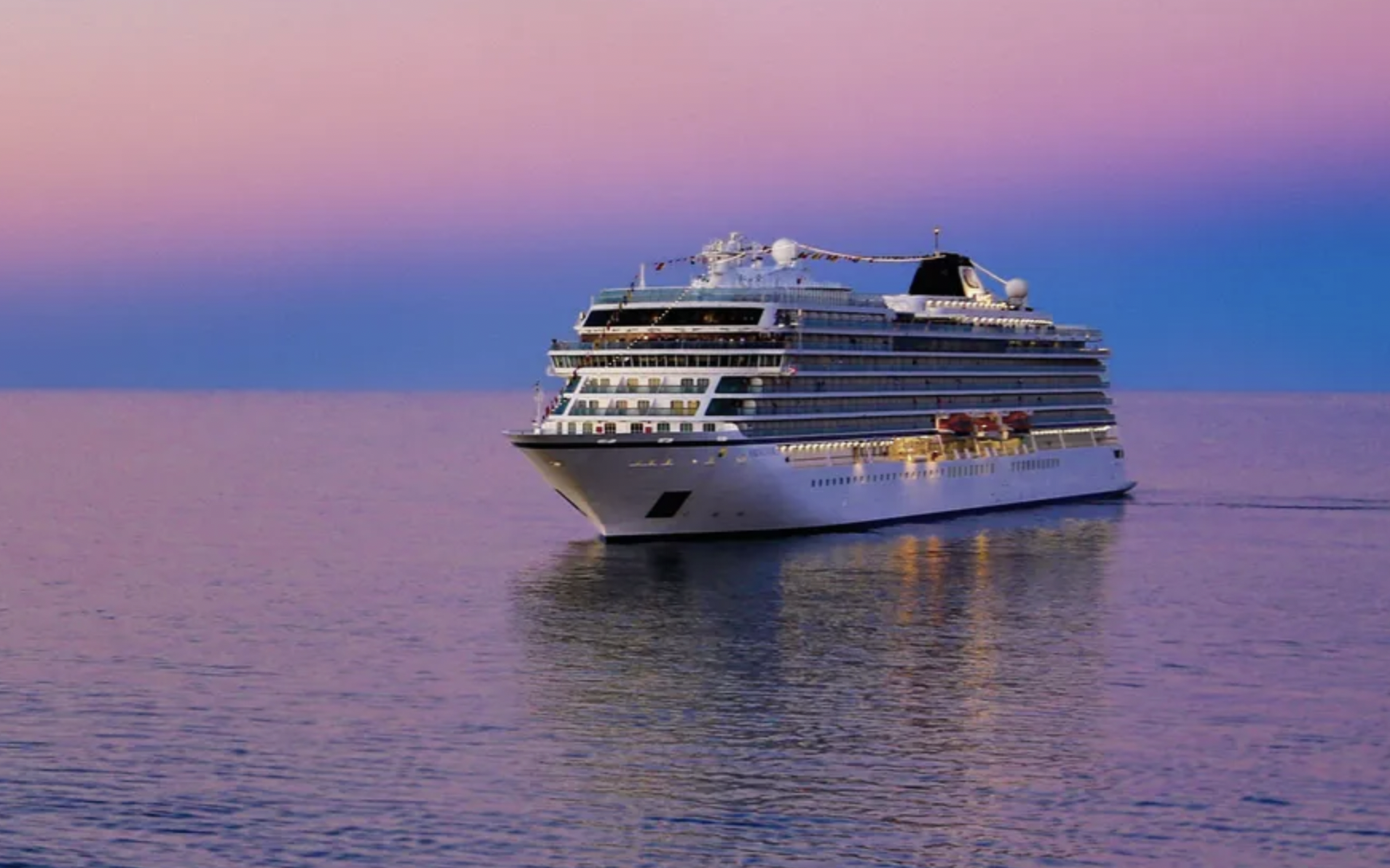 Large cruise ship sailing in calm evening light