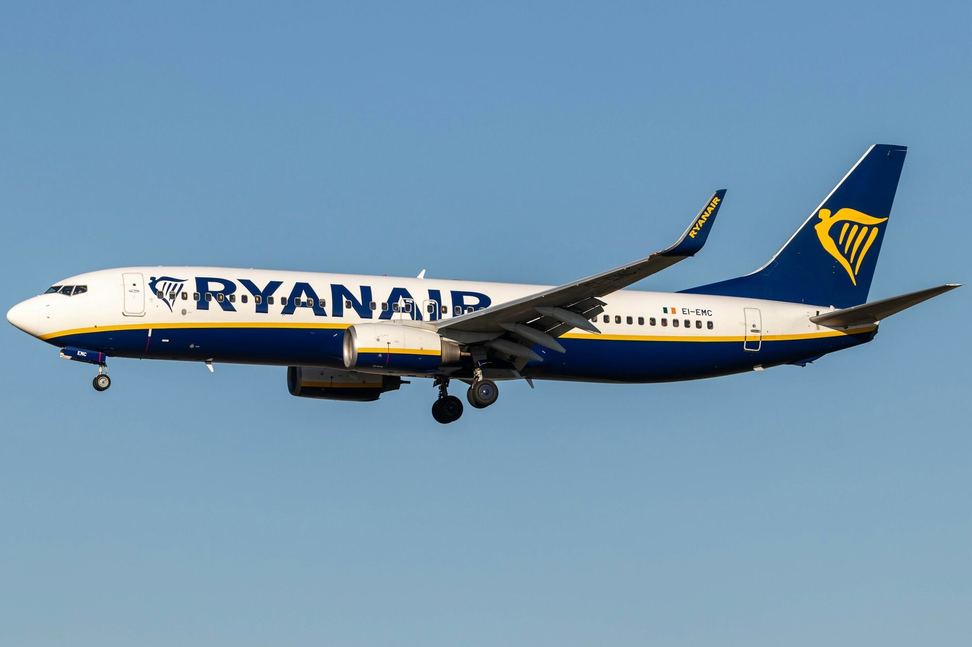 Ryanair aircraft in flight against blue sky