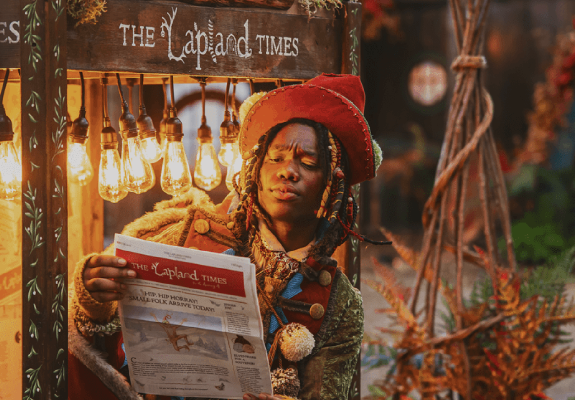 Elf reading Lapland Times newspaper display