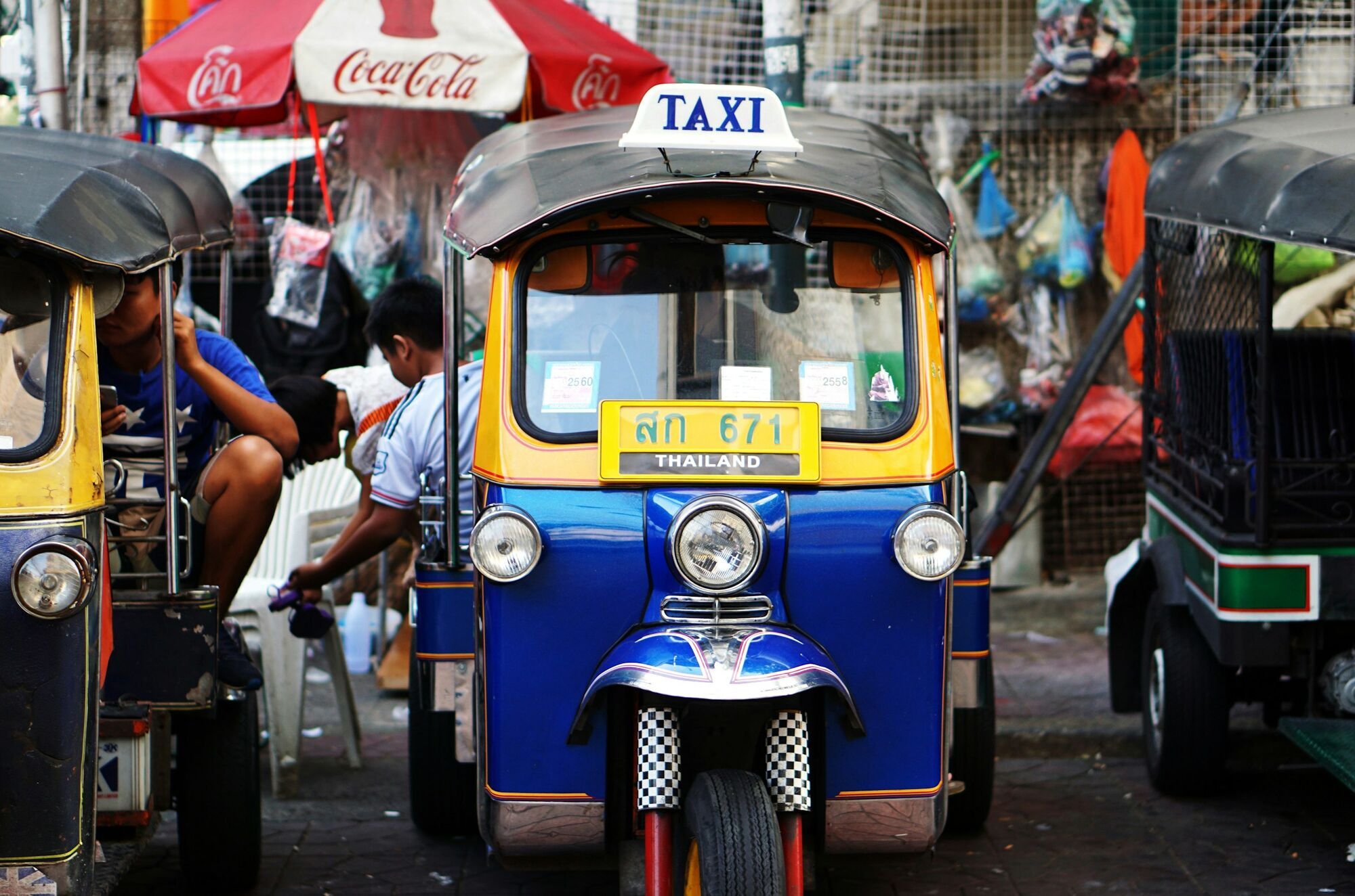 Tuk-tuk taxi waiting on Bangkok street