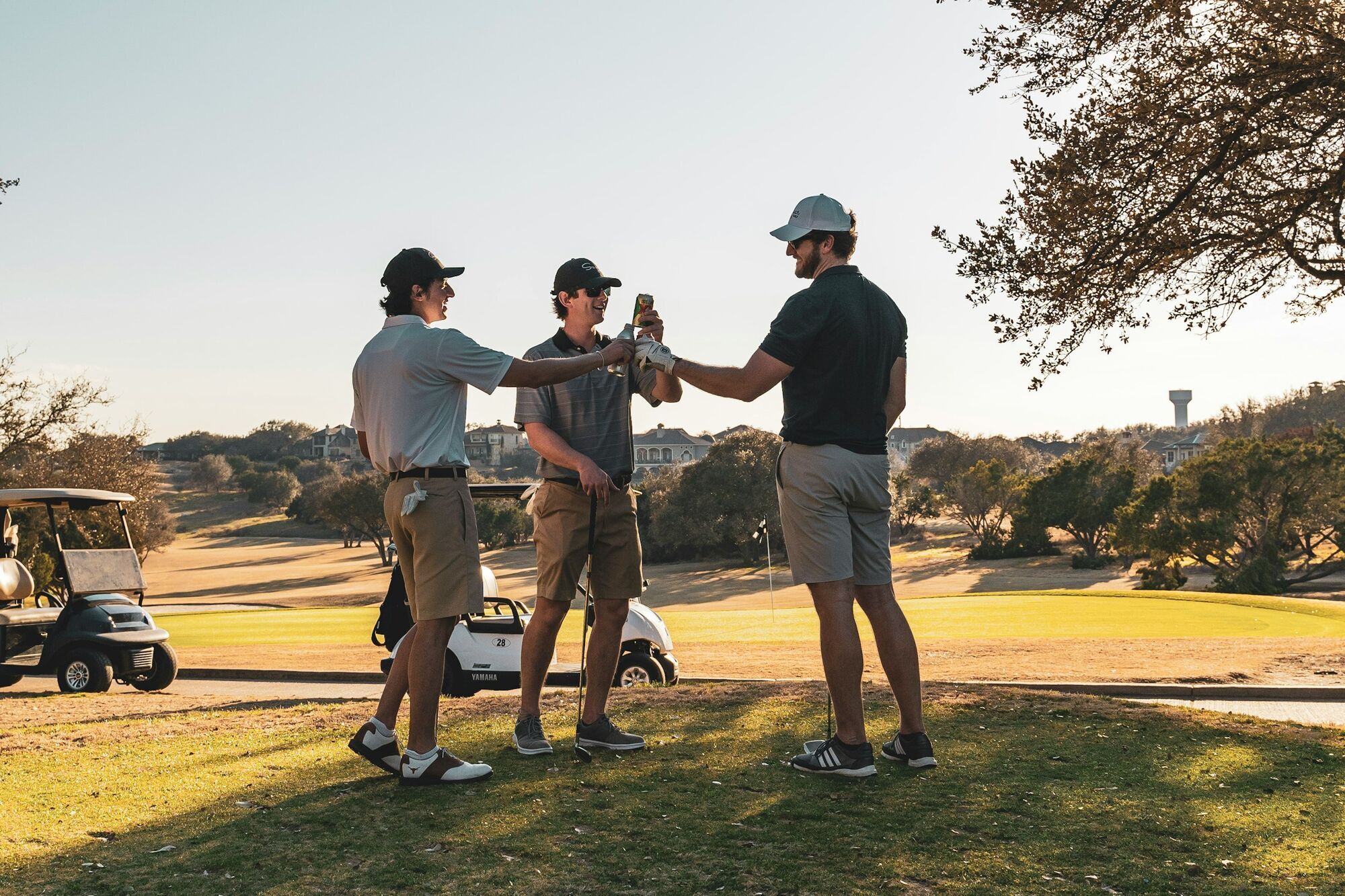 Group of golfers socialising on course