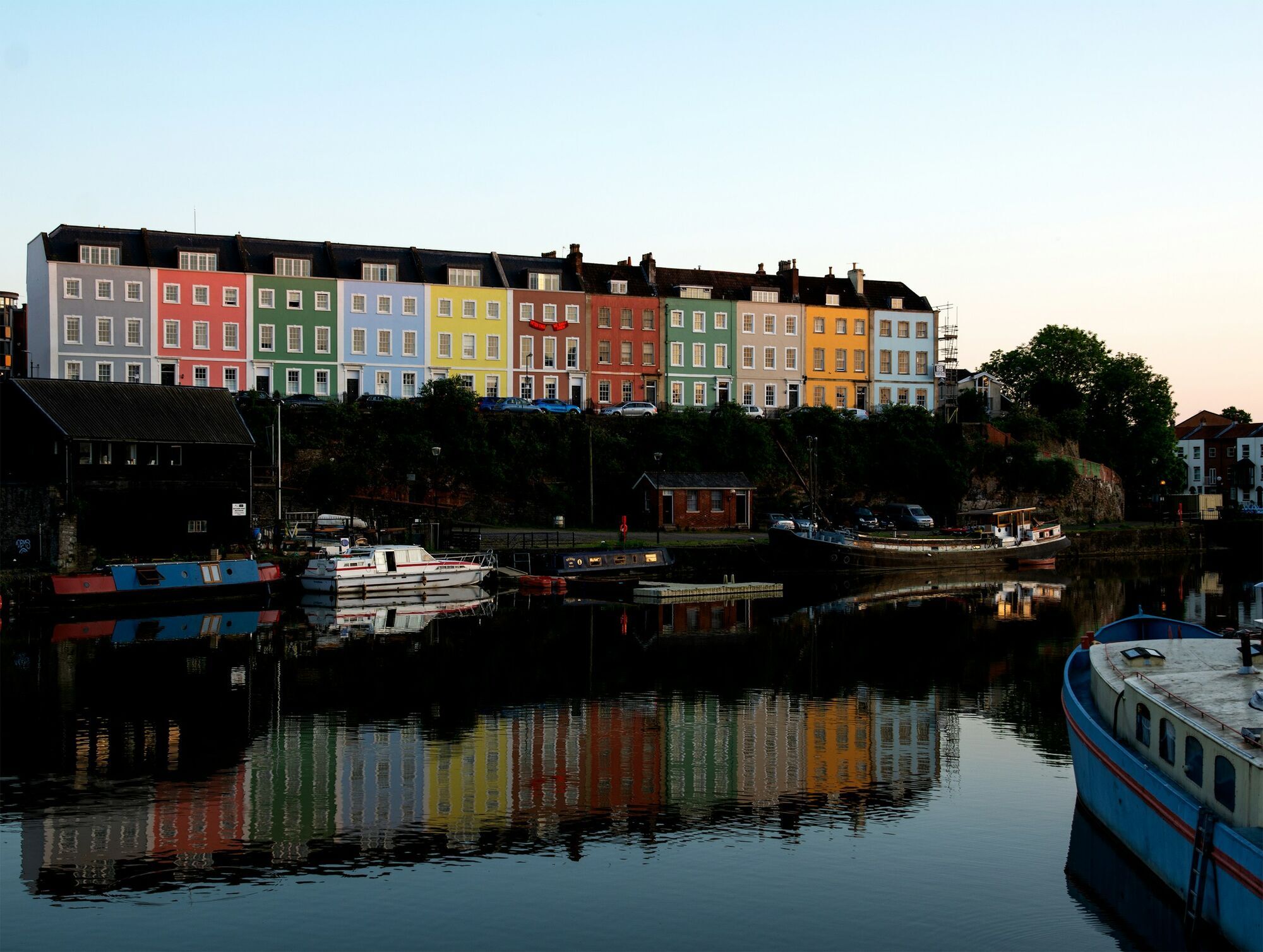 Colourful houses along waterfront in Bristol at sunset