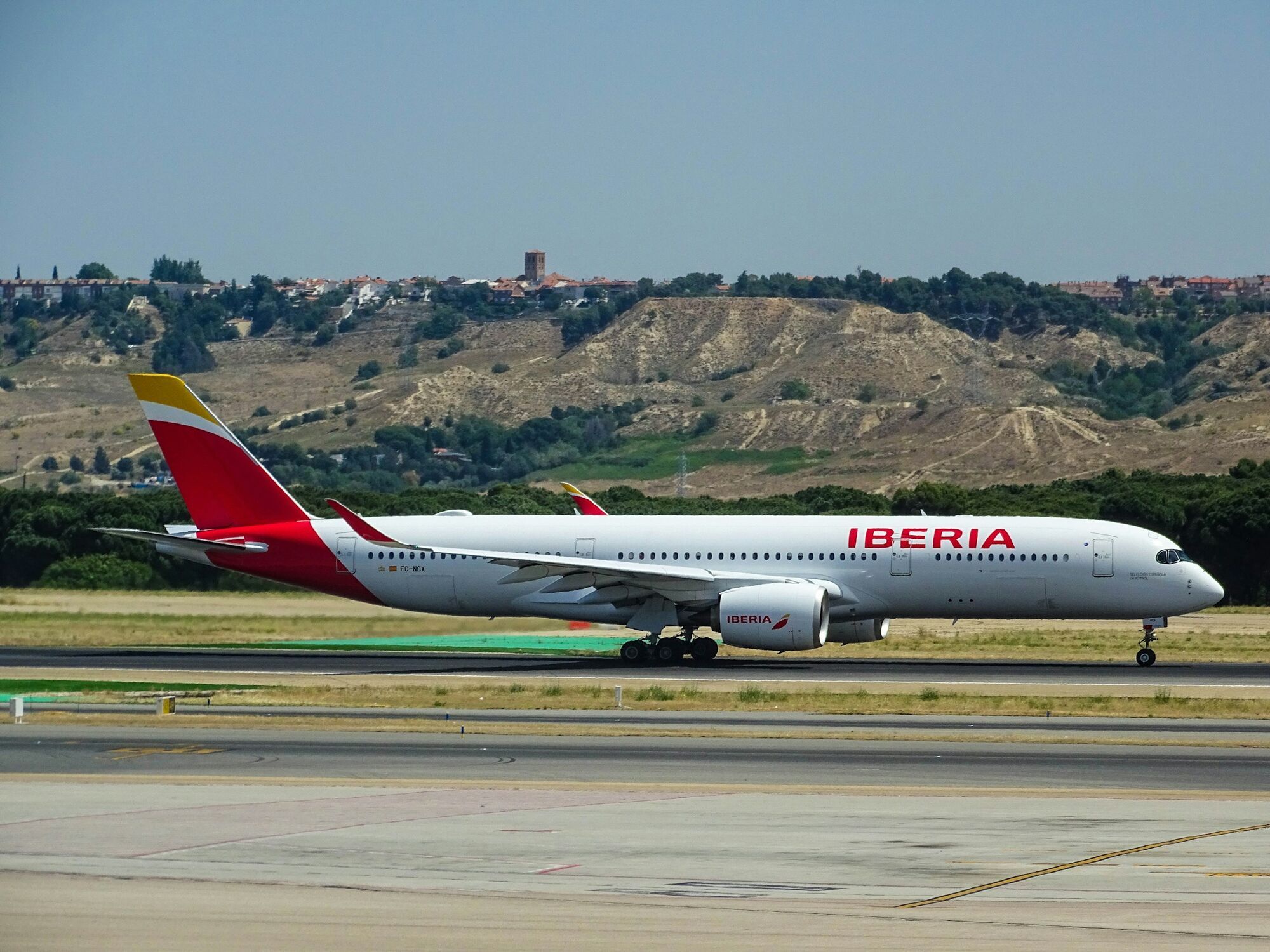 Iberia aircraft taxiing on runway near Madrid