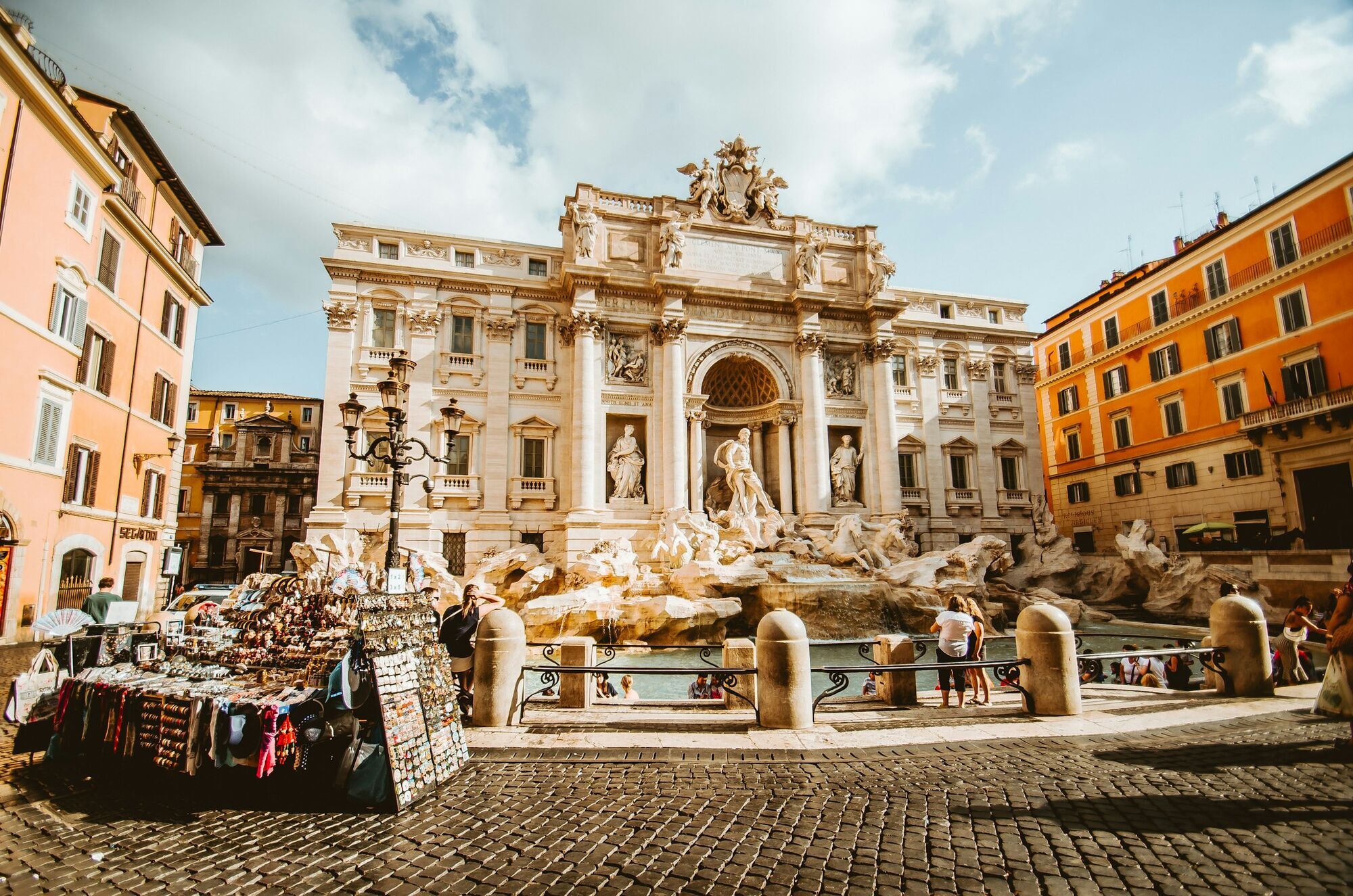 Trevi Fountain in Rome with visitors in the square