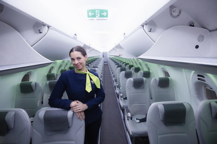 airBaltic cabin interior with crew member on board
