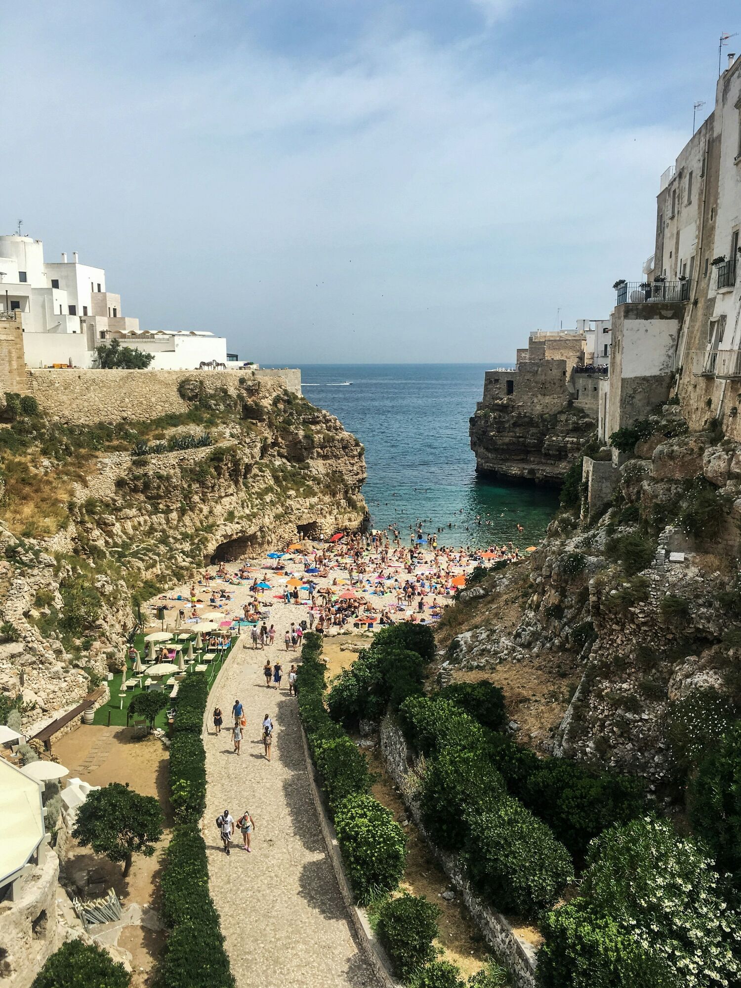 Lama Monachile beach between cliffs in Polignano a Mare
