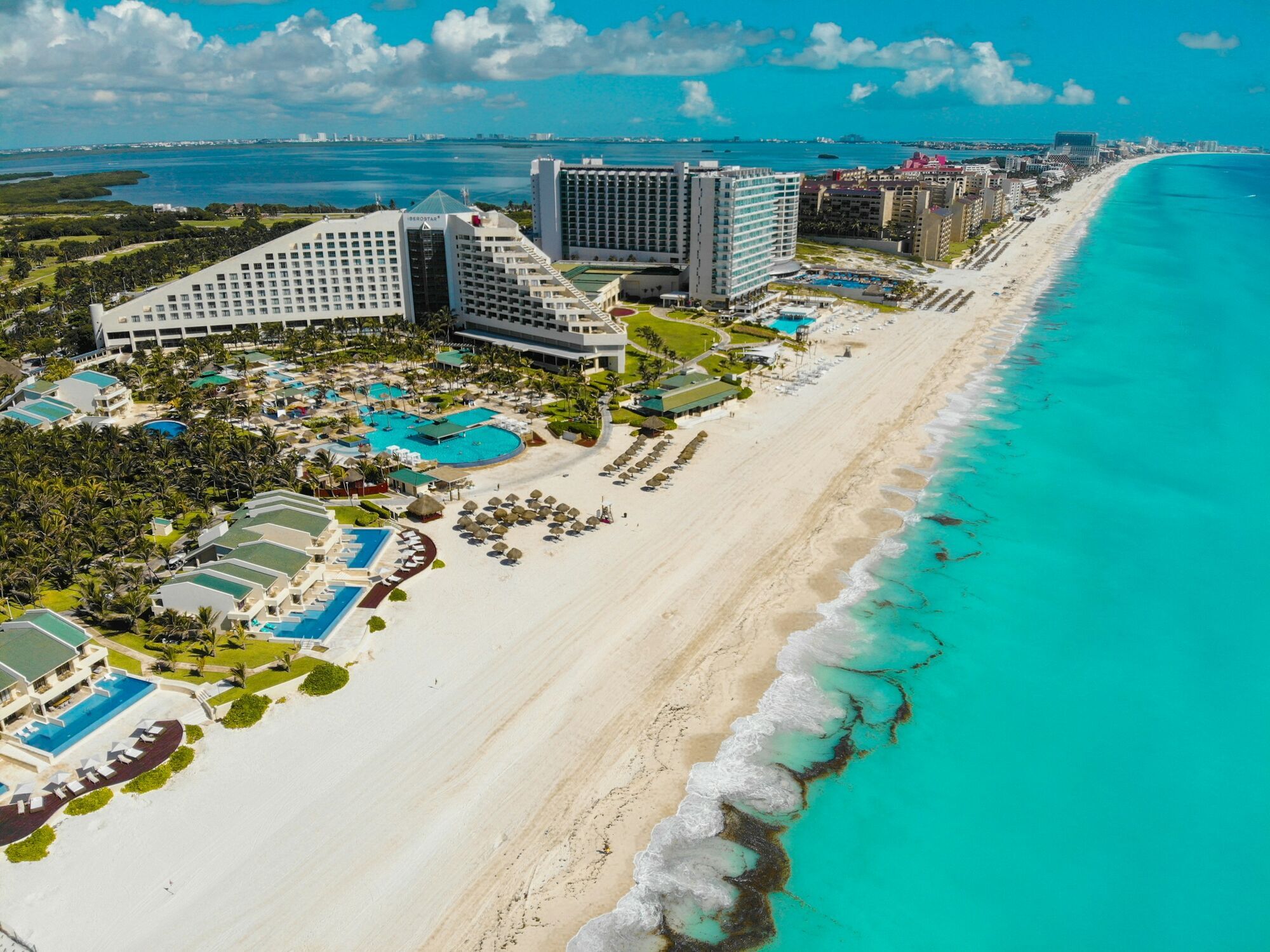 Resort hotels and beach along Cancun coastline