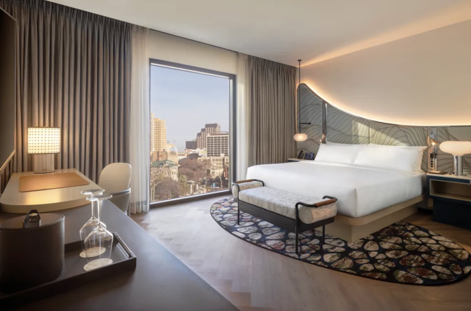 Modern hotel room interior with large city-view window