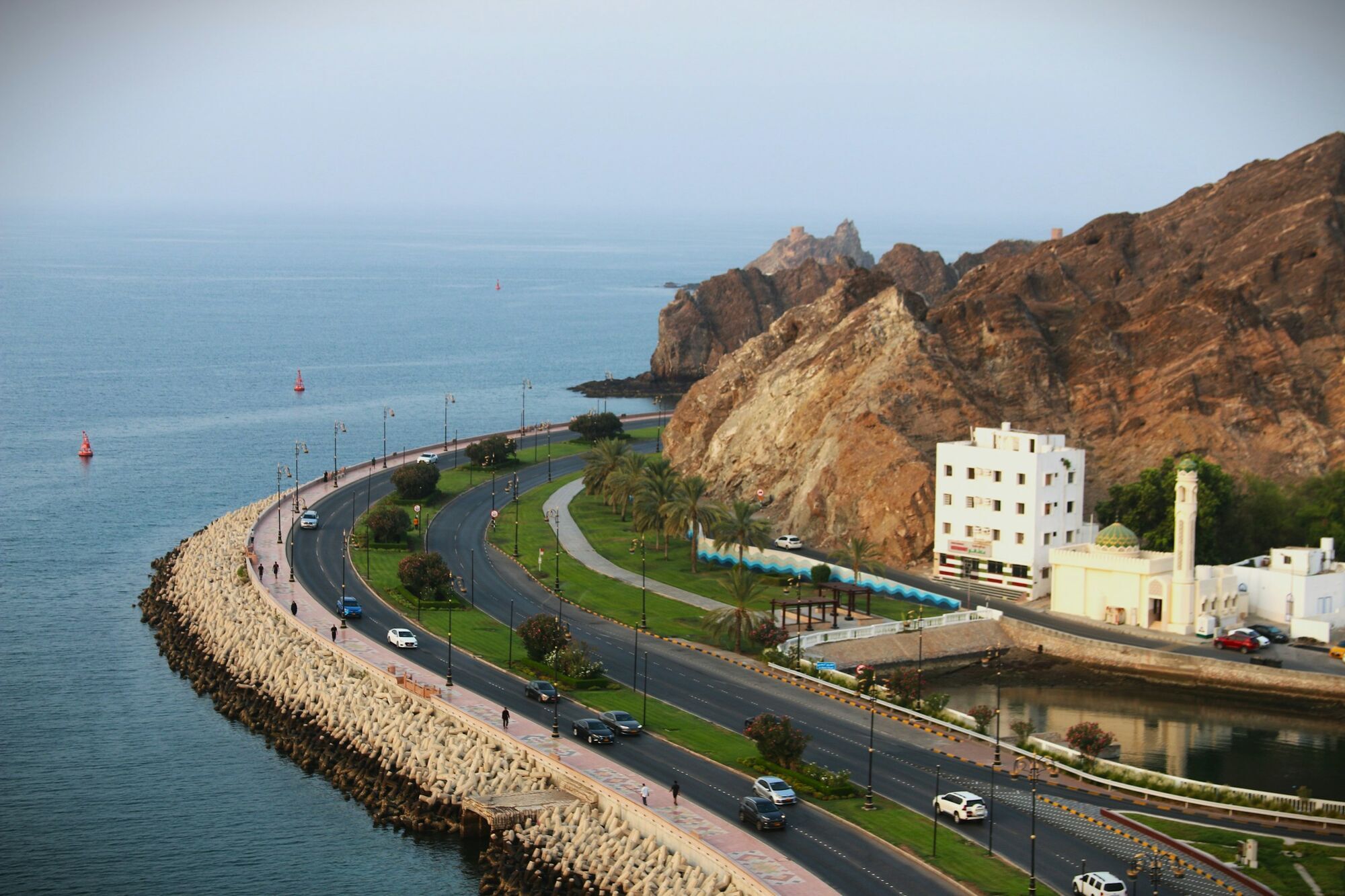 Coastal road and rocky coastline in Muscat, Oman