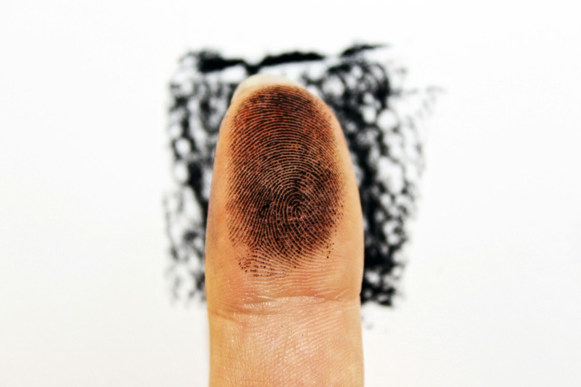 Close-up of finger with visible fingerprint used for identification