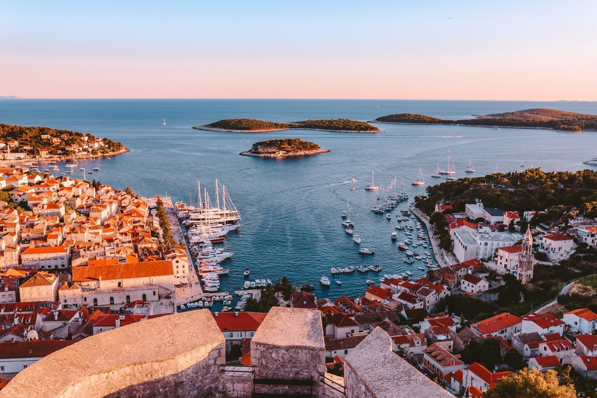Coastal town and marina with boats among Adriatic islands