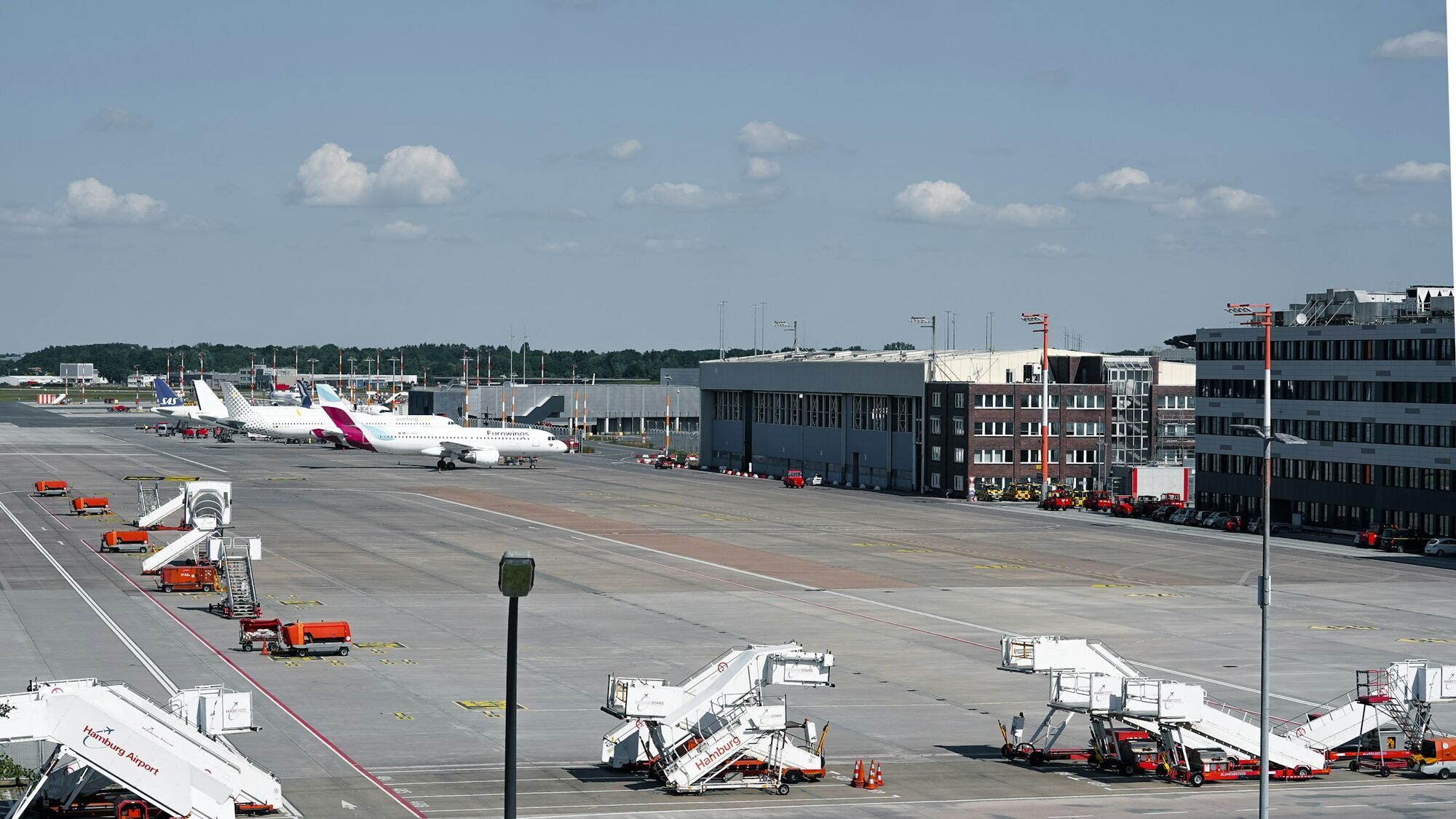 Aircraft parked at Hamburg Airport terminal stands