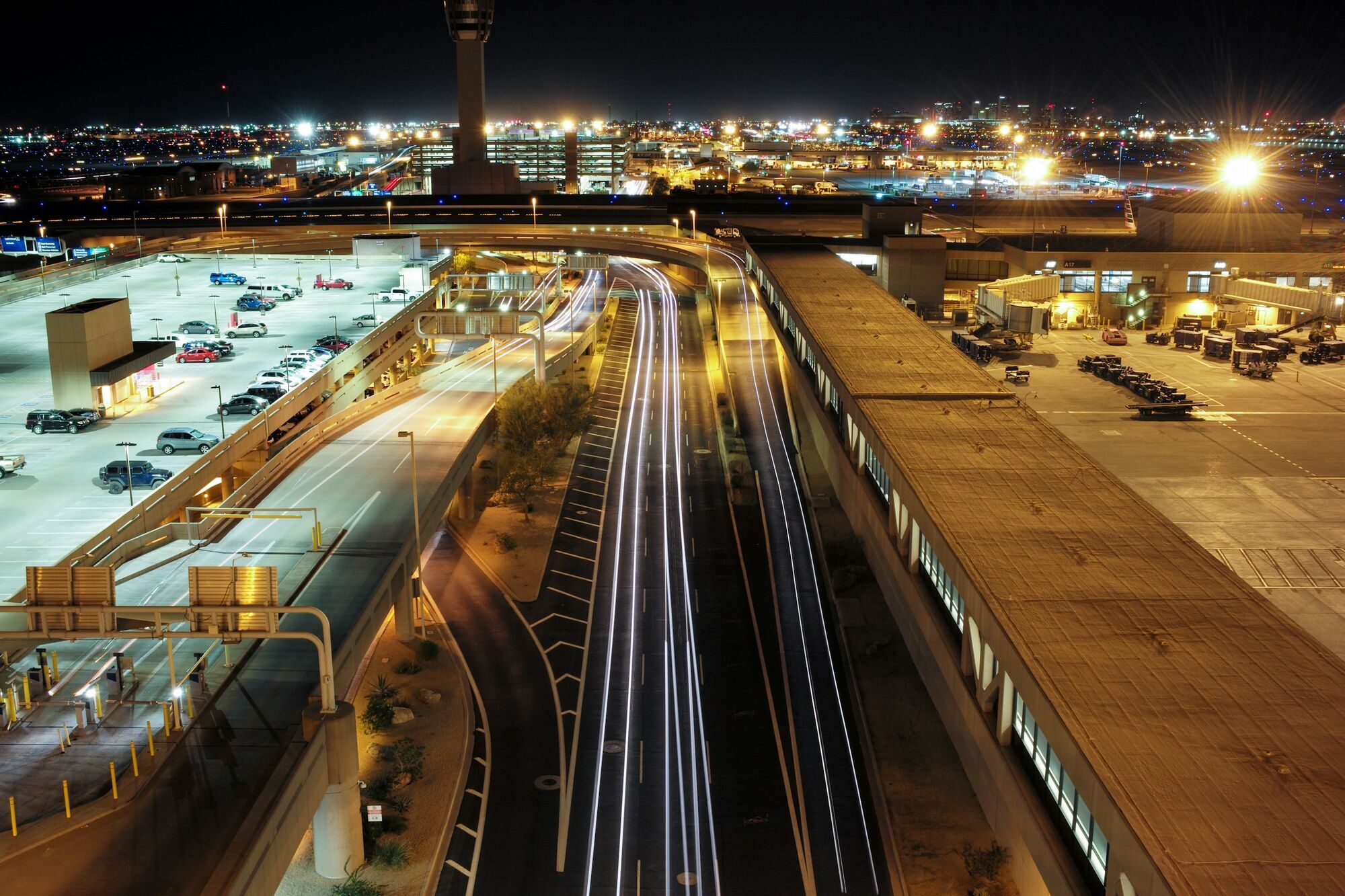 Night view of airport parking buildings and access roads