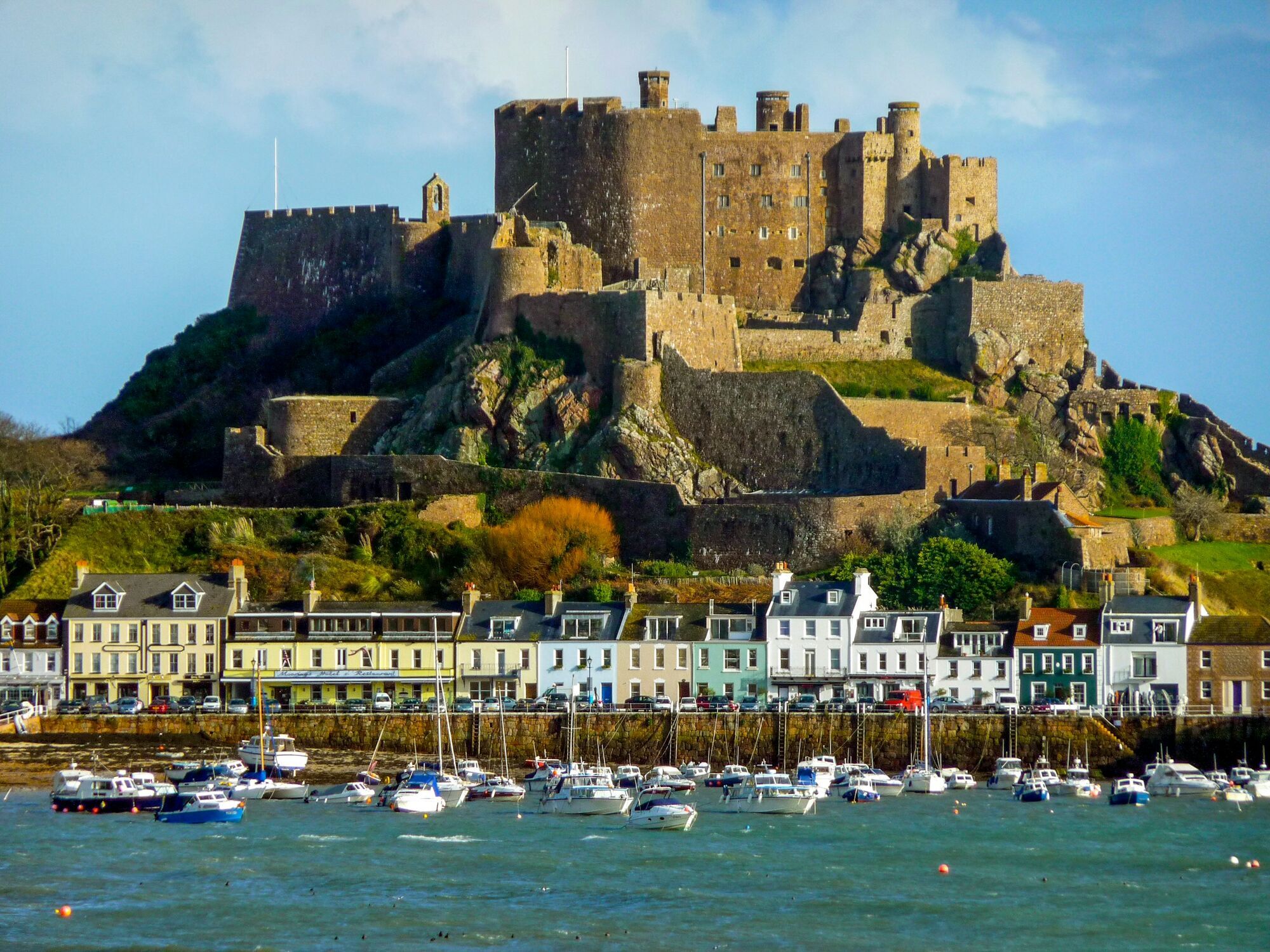 Historic castle and harbour coastline in Jersey