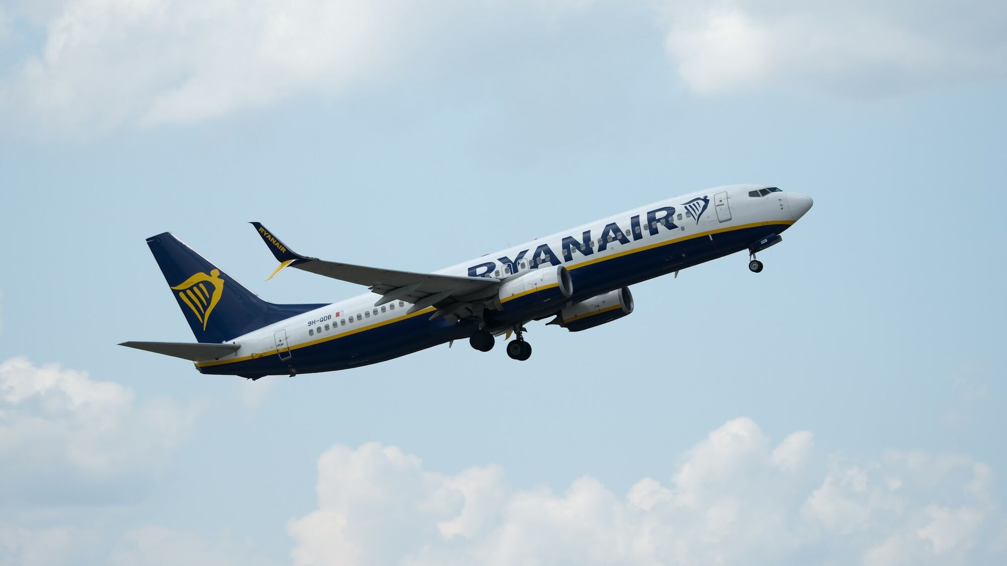 Ryanair aircraft in flight against blue sky