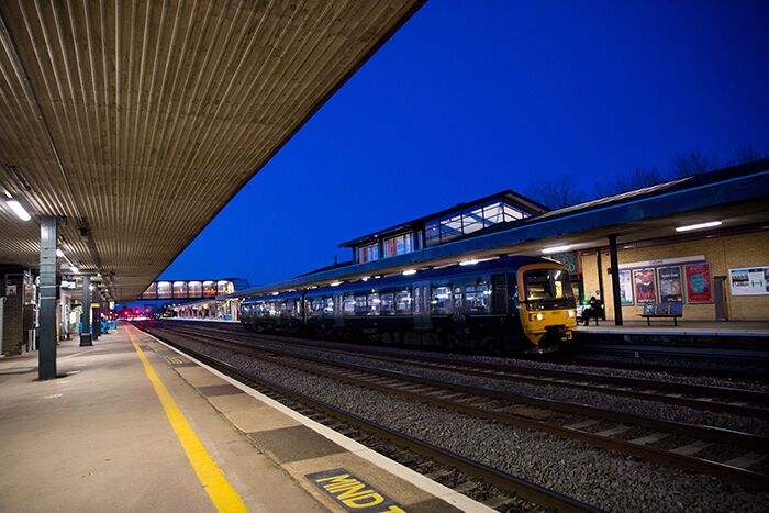 Passenger train standing at railway station platform