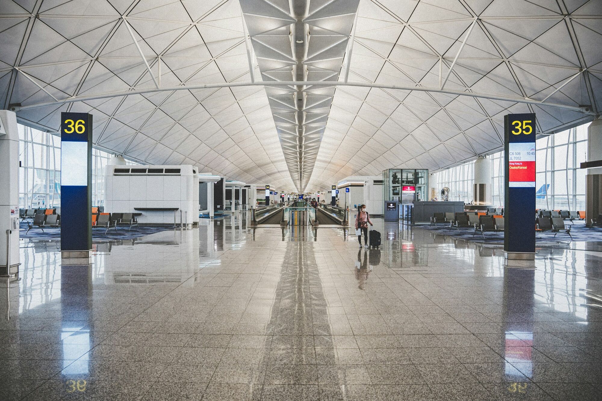 Interior of airport terminal with departure gate signs