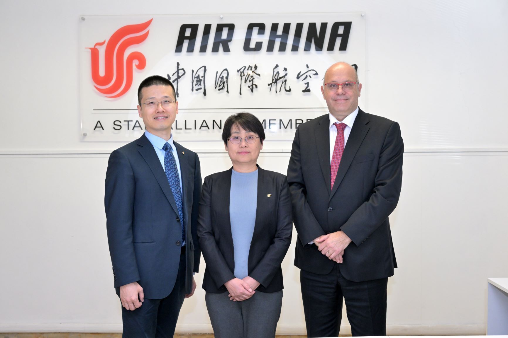 Air China and AEGEAN executives posing after partnership signing