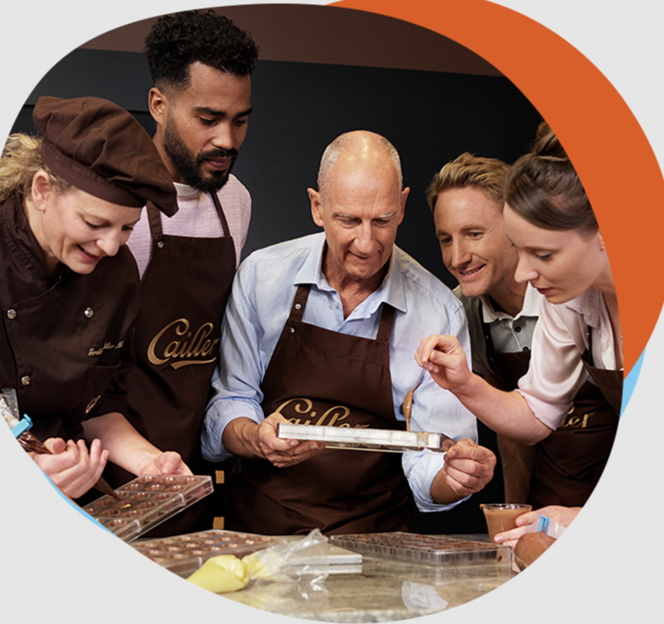 Visitors learning chocolate making at Maison Cailler workshop