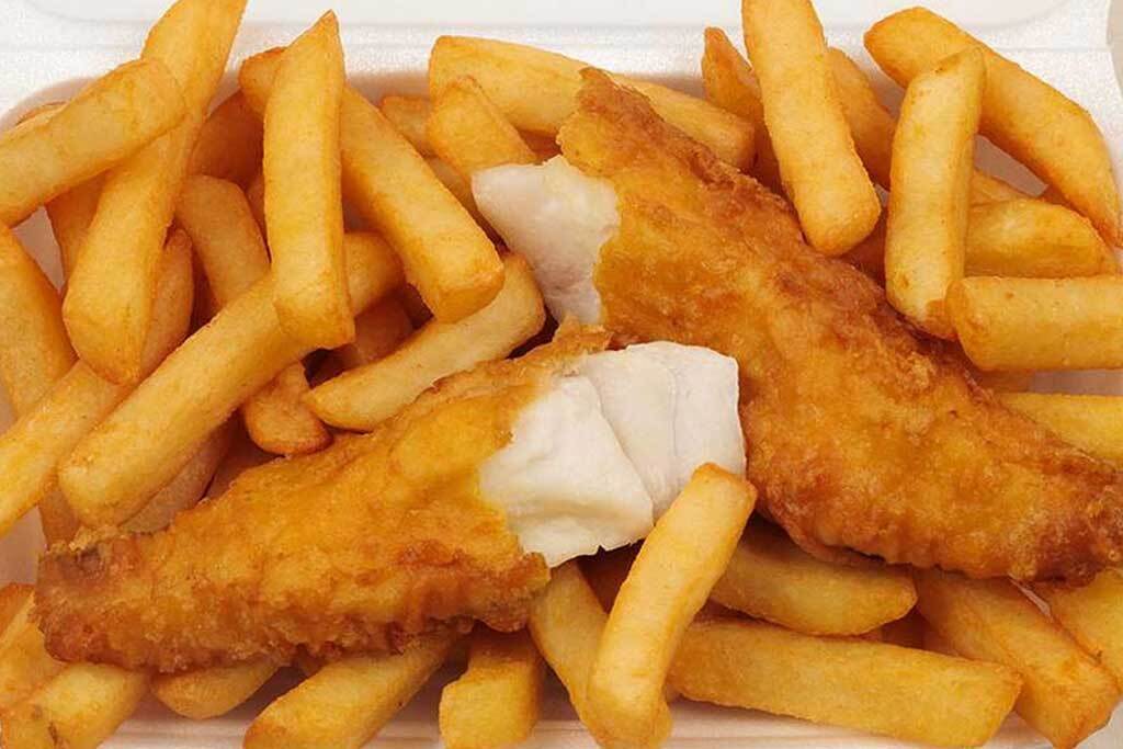 Traditional fish and chips served in takeaway tray