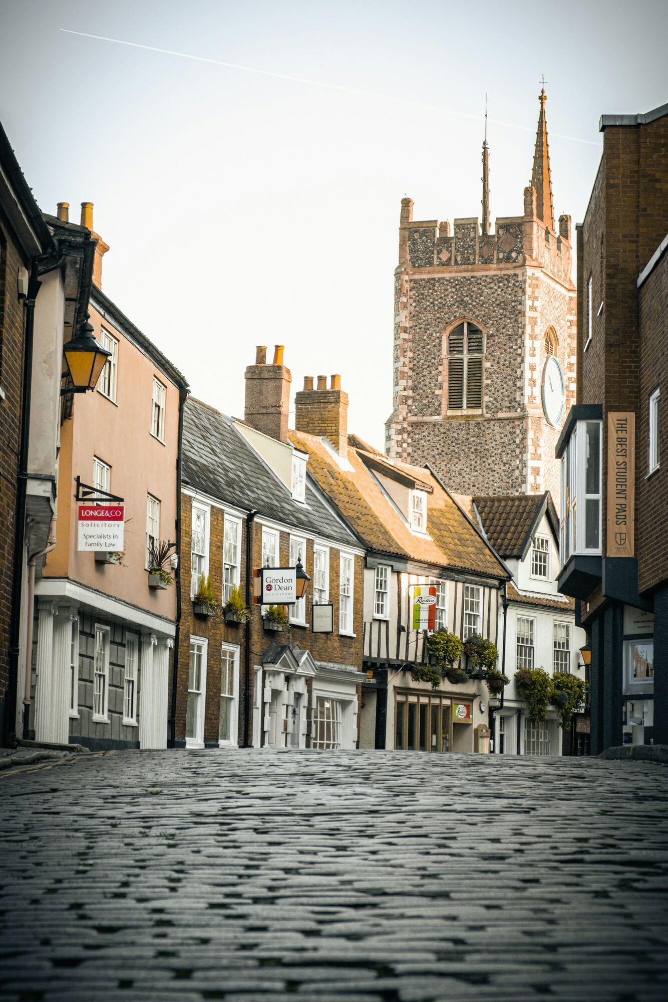 Historic street and church tower in Norwich