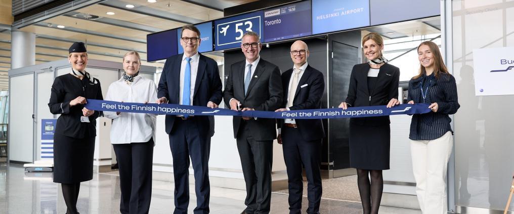 Finnair representatives celebrating the Toronto route launch