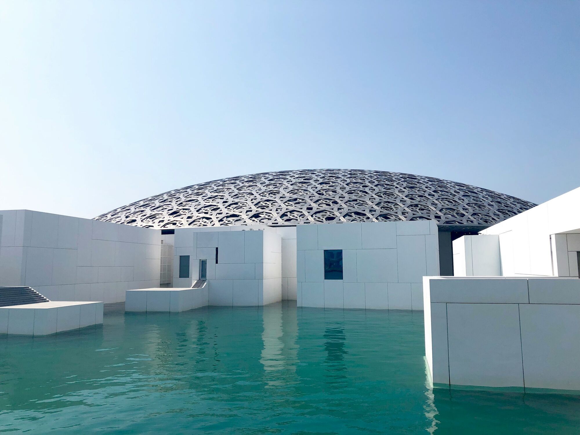 Louvre Abu Dhabi surrounded by water