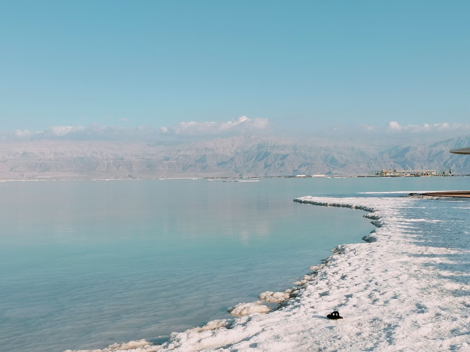 Dead Sea shoreline with mountains in the distance