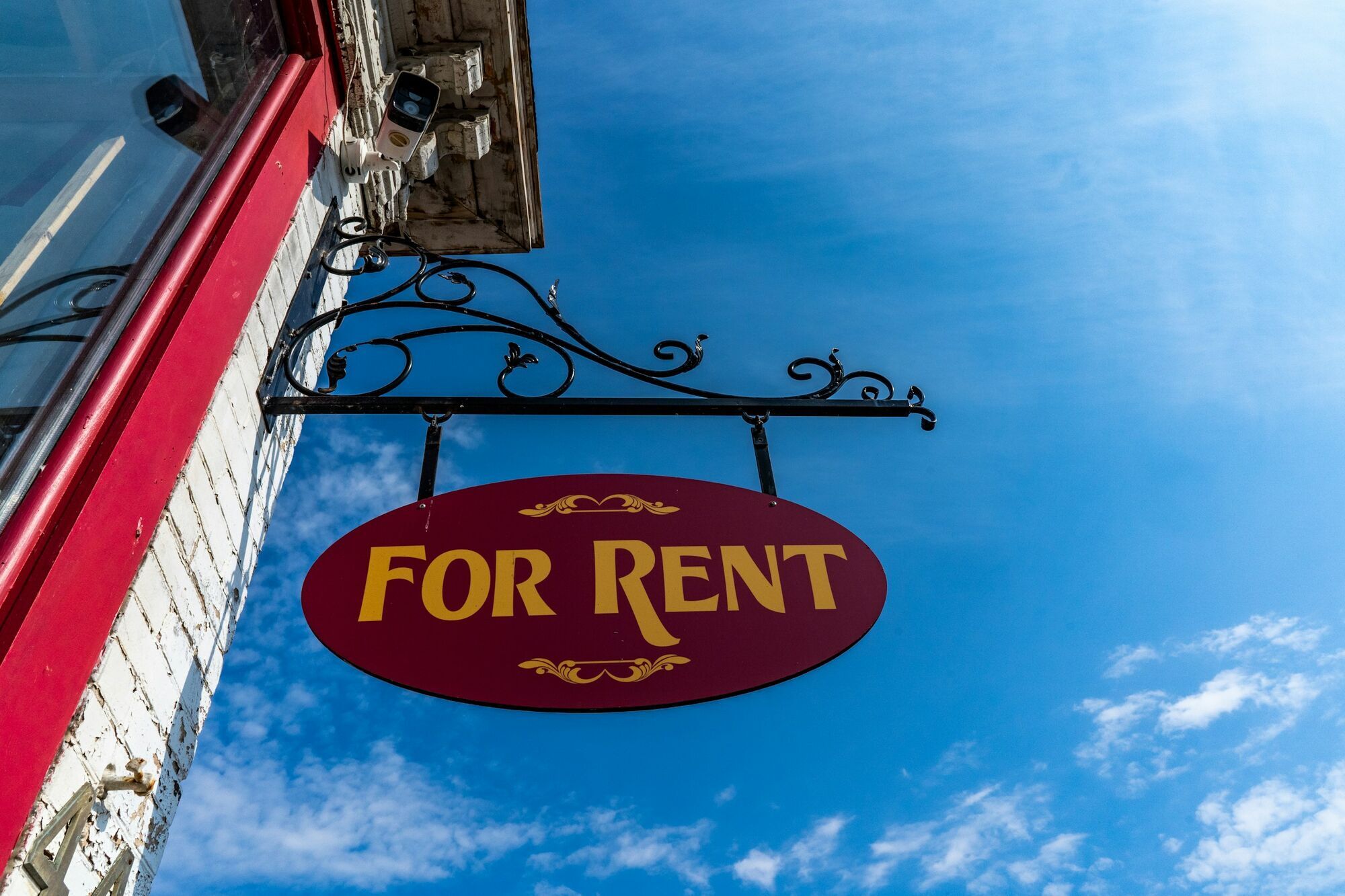For rent sign hanging outside a property