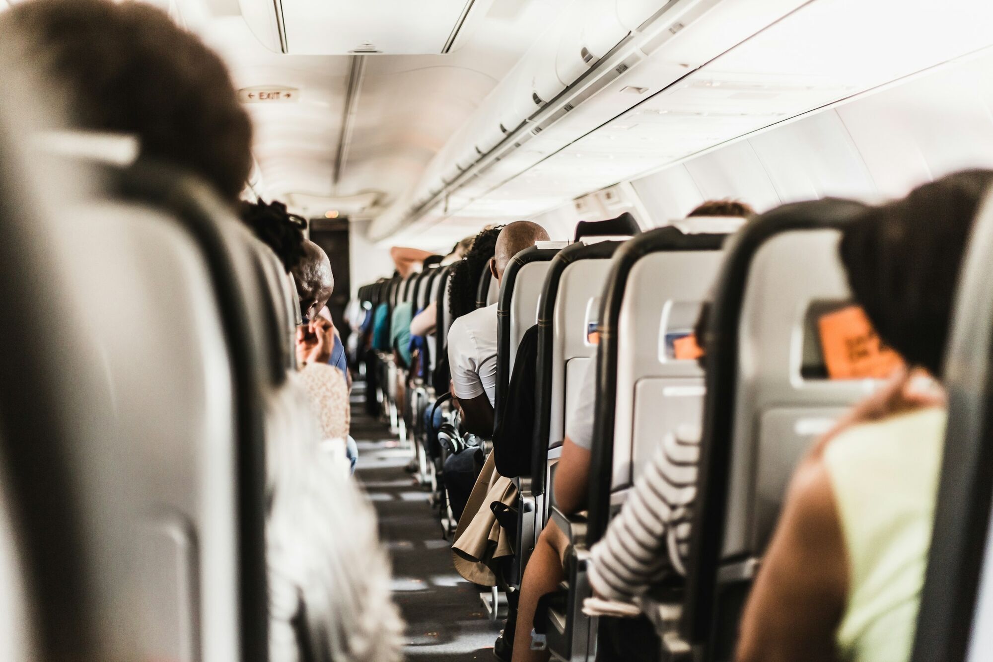 Passengers seated inside an aircraft cabin