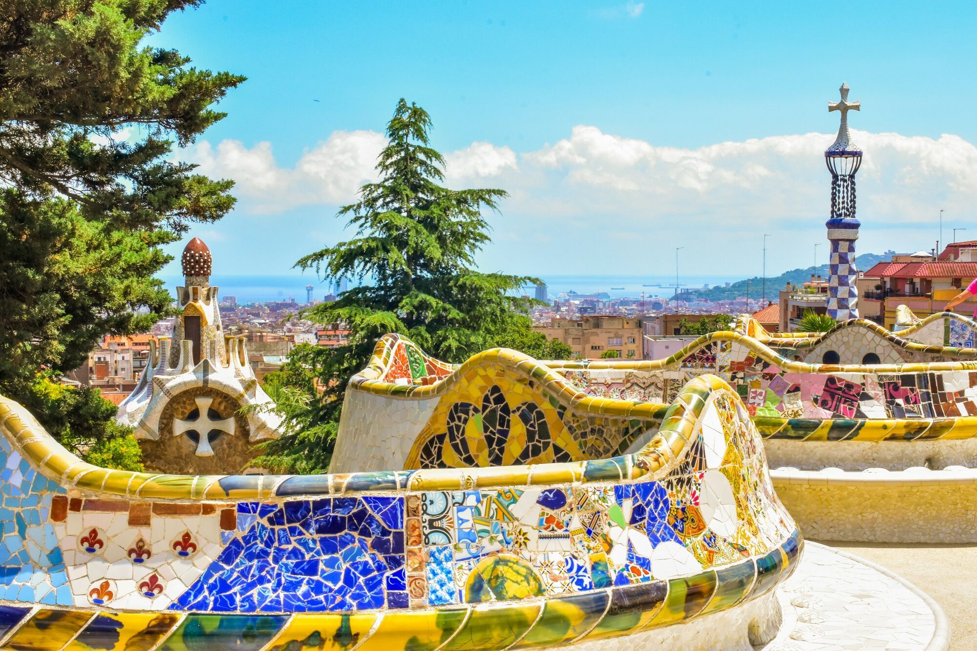 Colourful mosaic terrace at Park Güell overlooking Barcelona