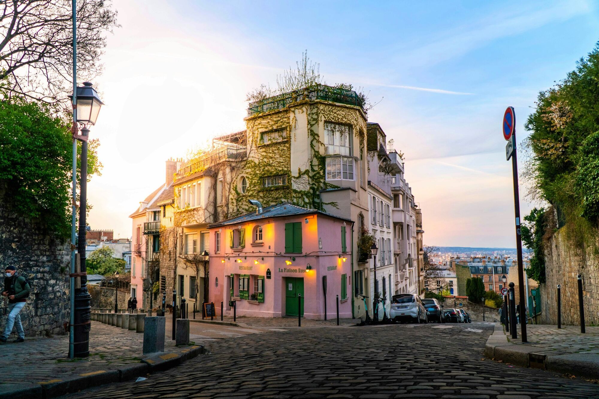 Quiet street in Montmartre with colourful buildings at sunset