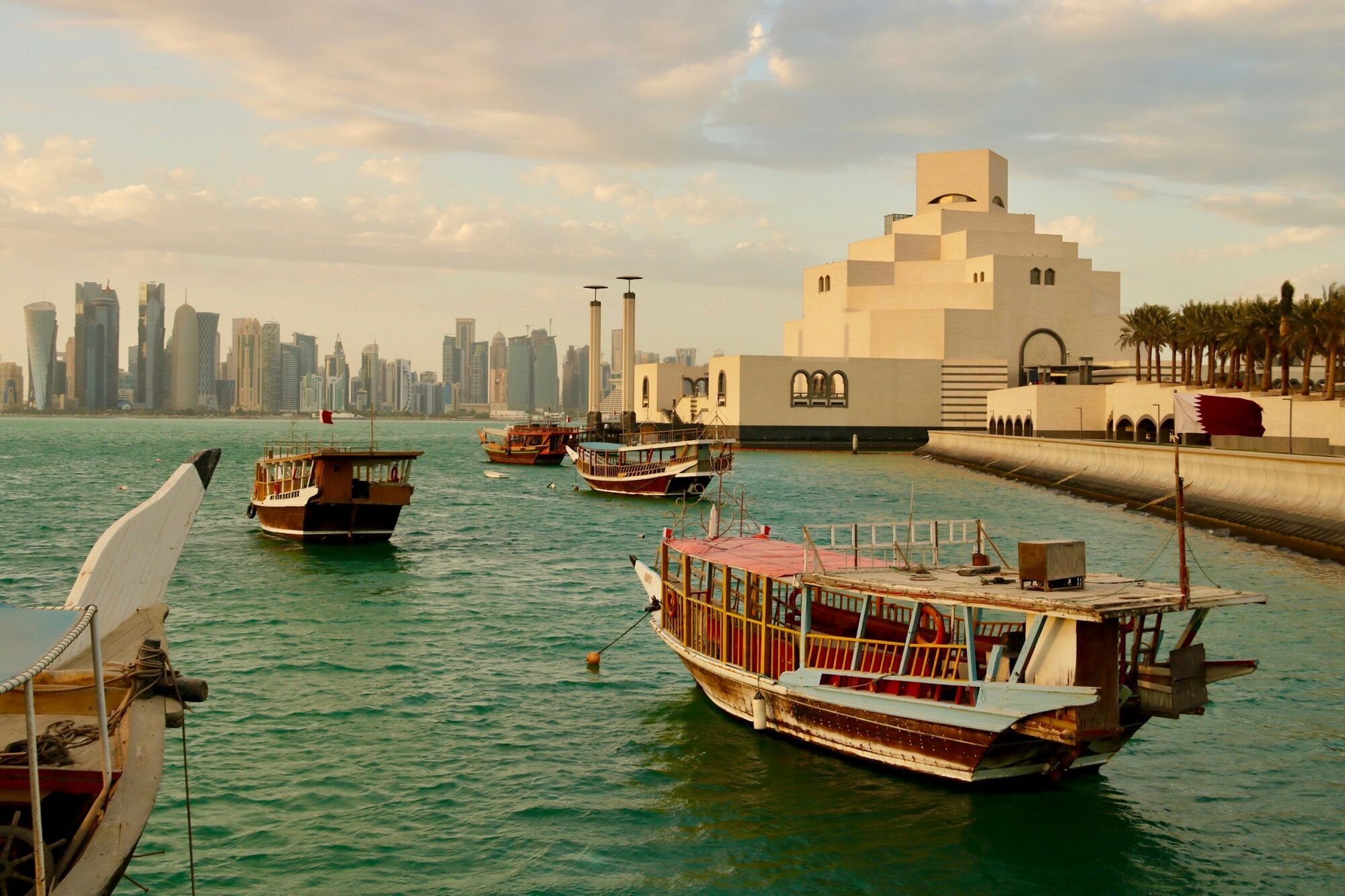 Traditional boats near Doha’s Museum of Islamic Art and skyline