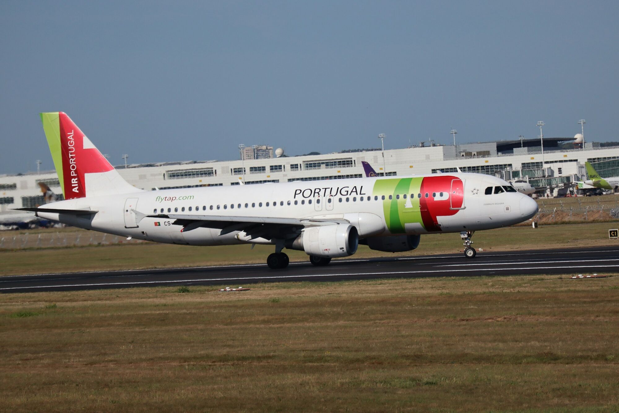 TAP Air Portugal aircraft taxiing at an airport