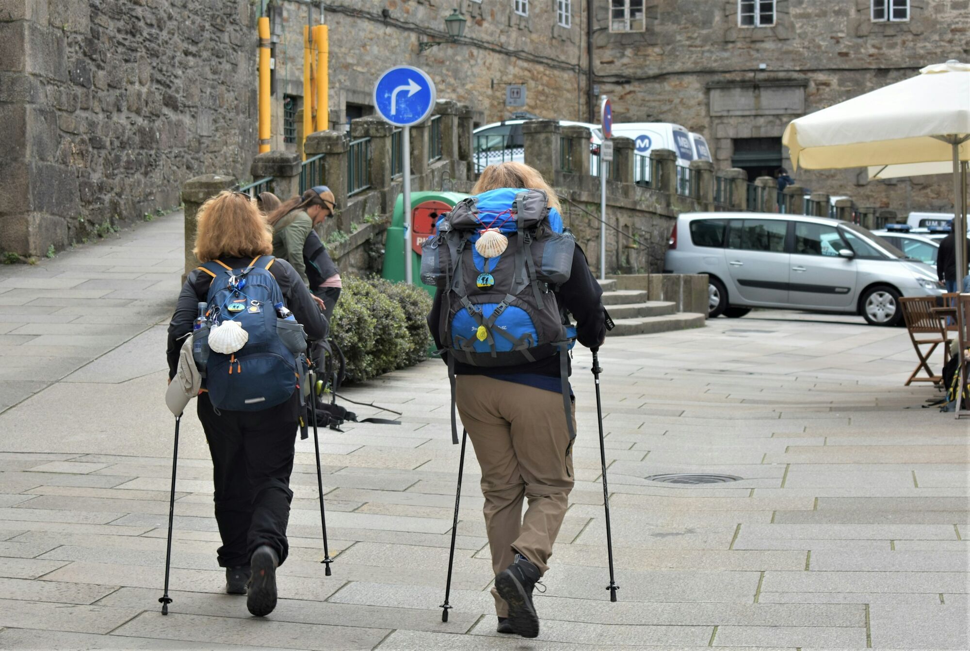 Pilgrims walking through Santiago de Compostela