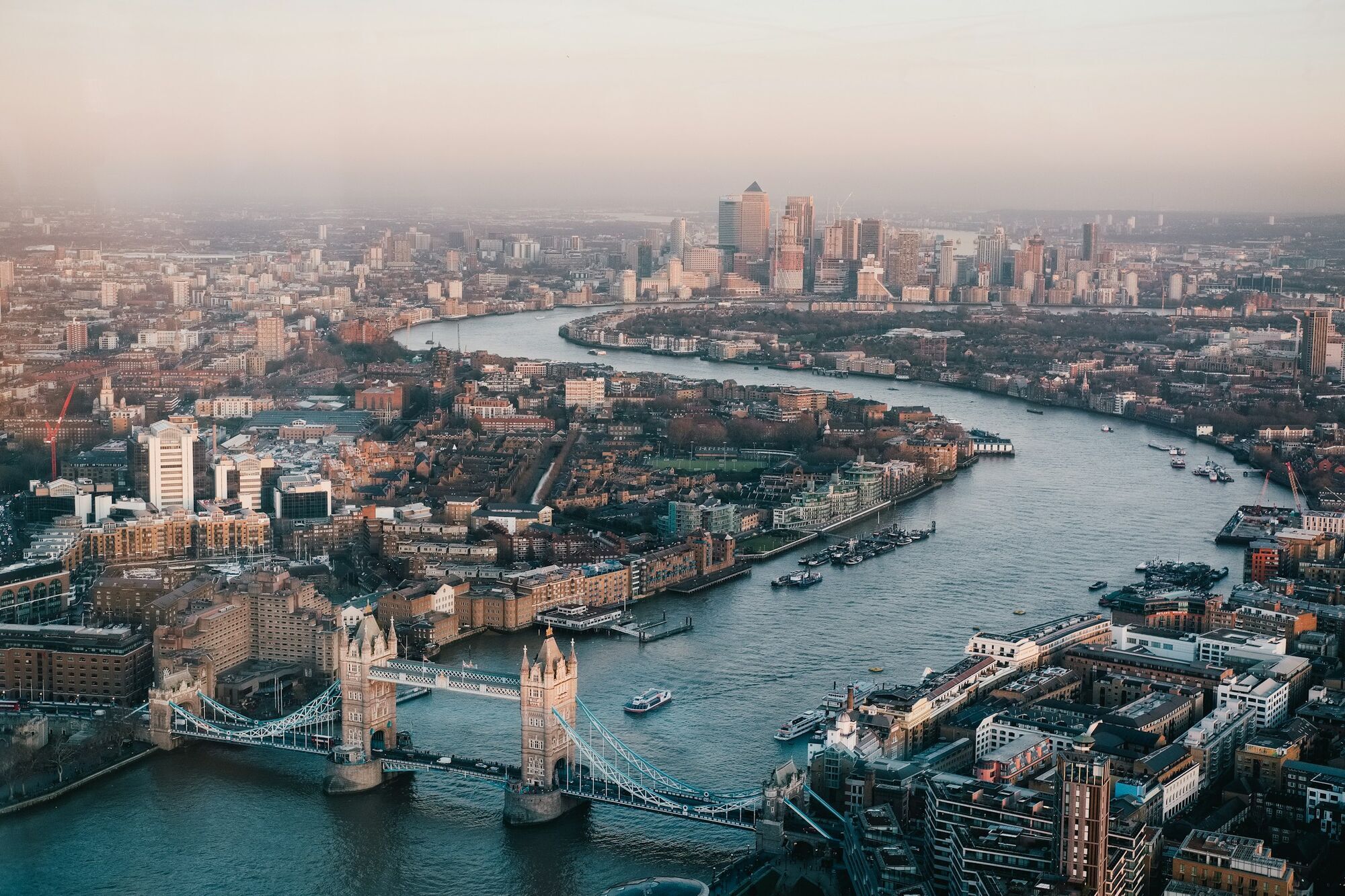 Aerial view of Tower Bridge, the River Thames and Canary Wharf skyline